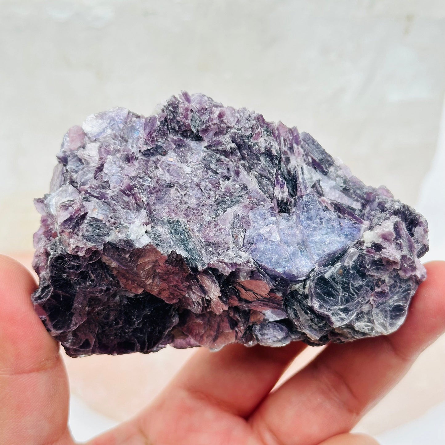 crystal cluster in hand for size reference 