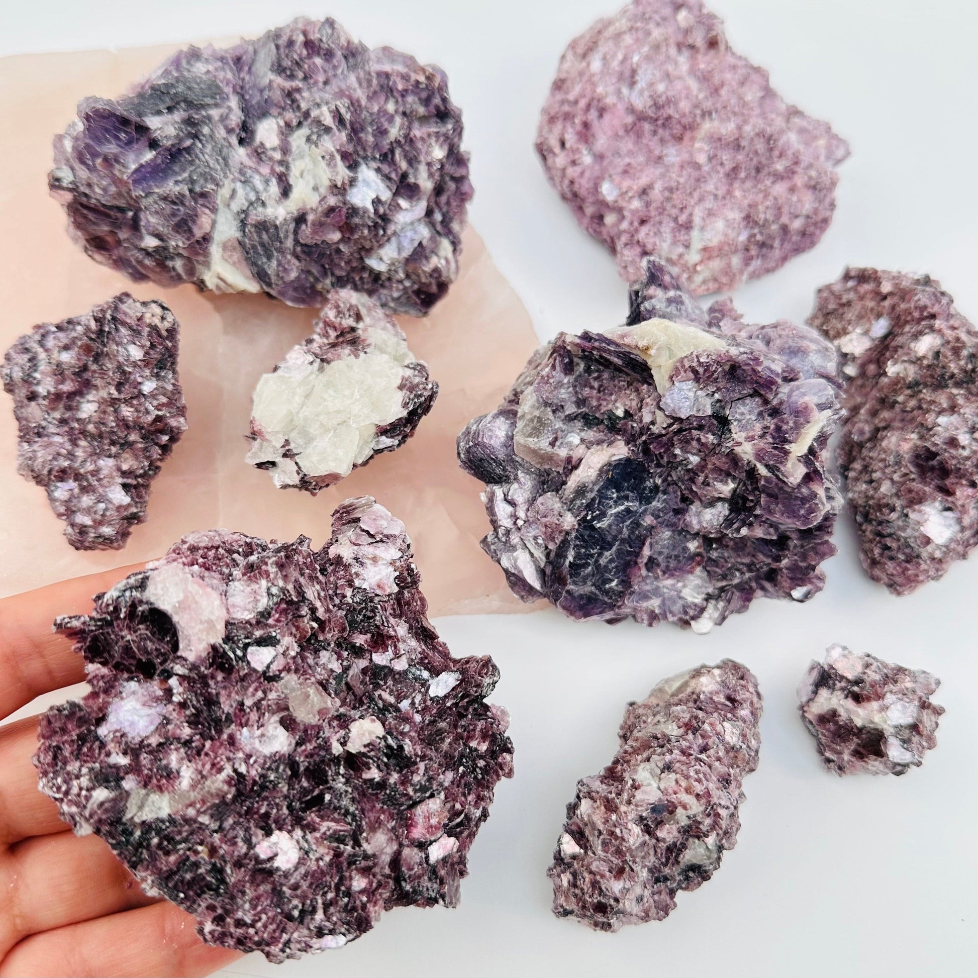 multiple crystal clusters displayed to show the differences in the sizes and color shades 