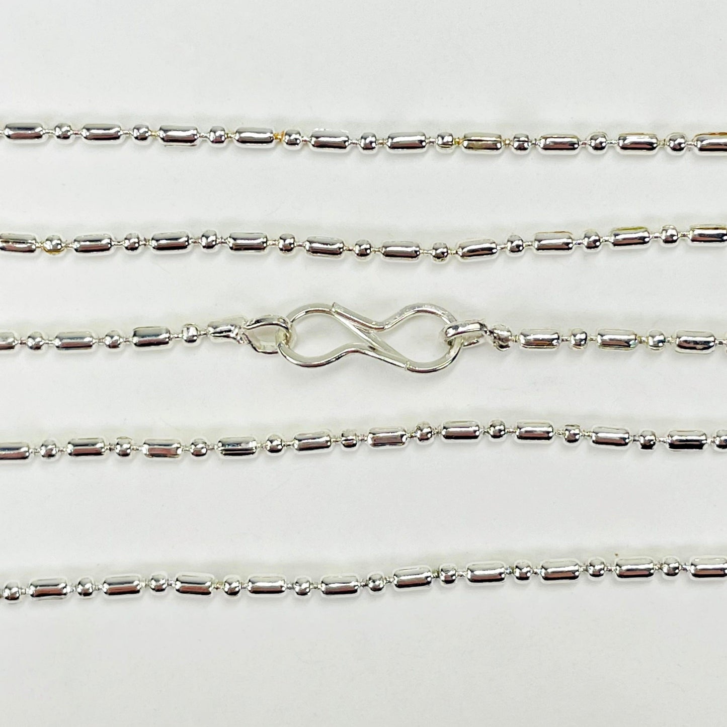 close up of necklace clasp and chain