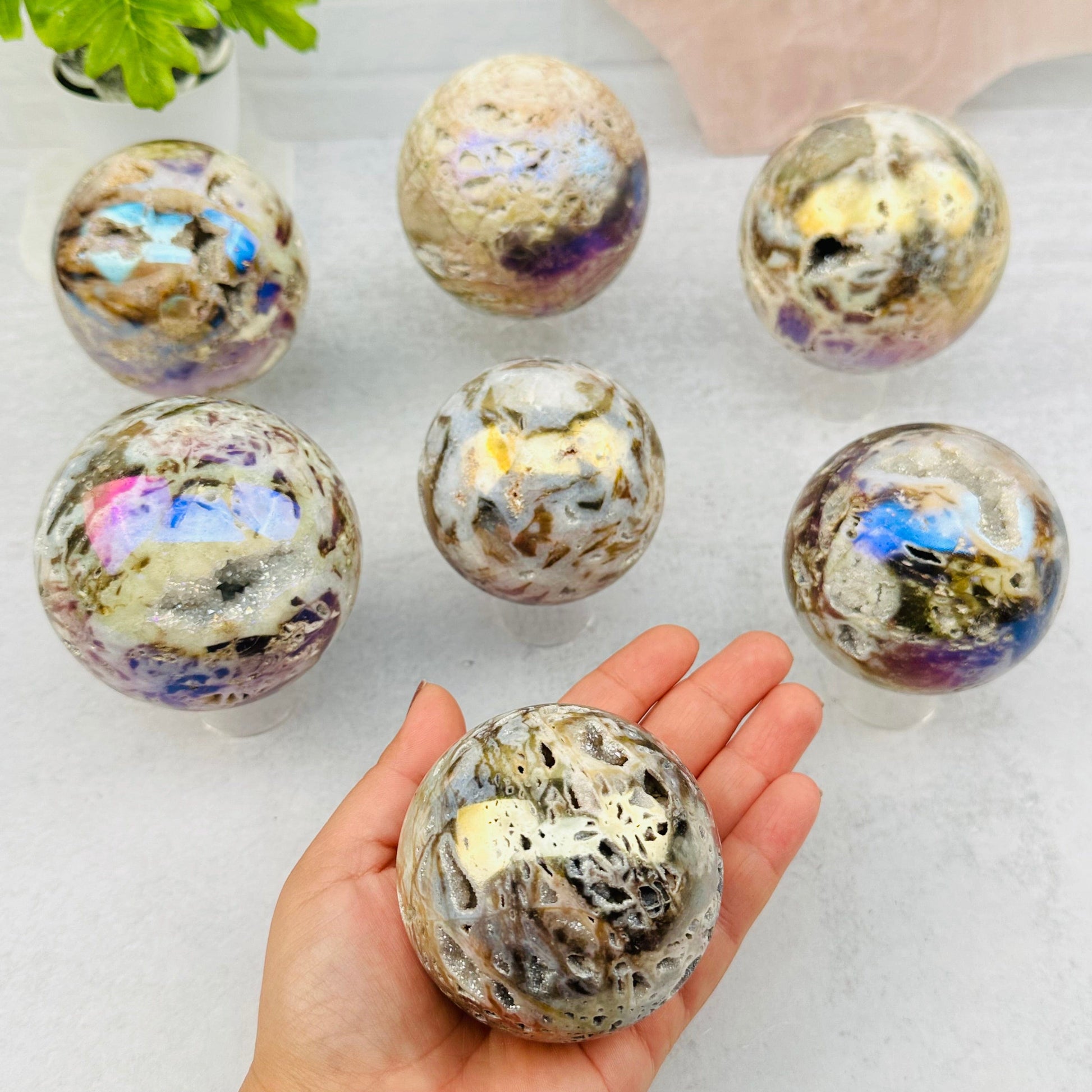 Angel Aura Sphalerite Sphere in hand for size reference 
