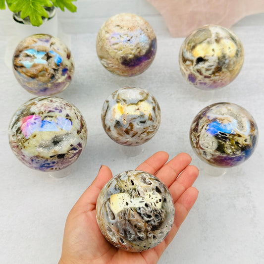 Angel Aura Sphalerite Sphere in hand for size reference 