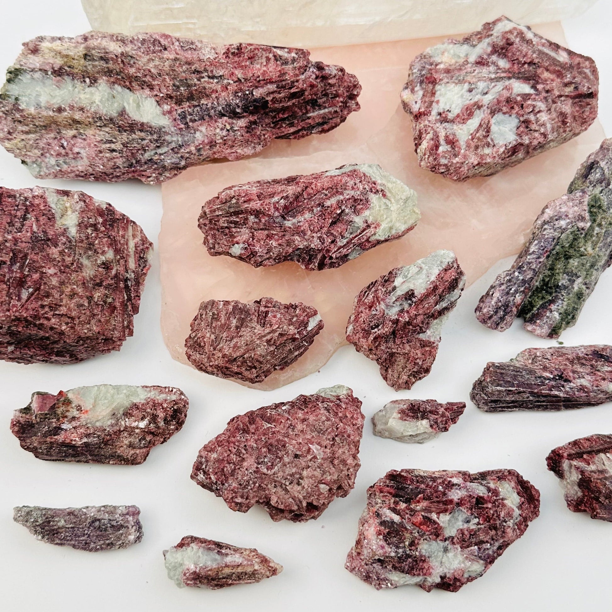 multiple crystals displayed to show the differences in the sizes and color shades