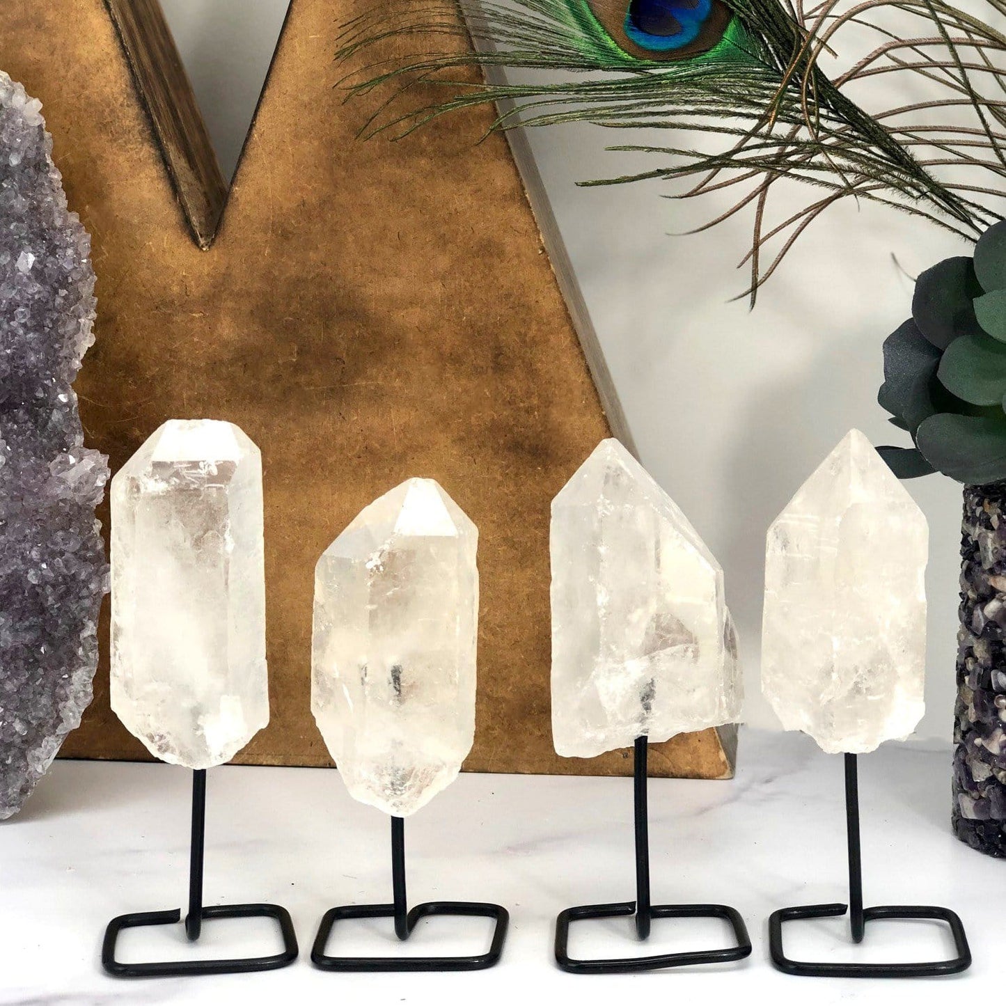 Products Natural Stone Crystal on Metal Stand - 4 on a table