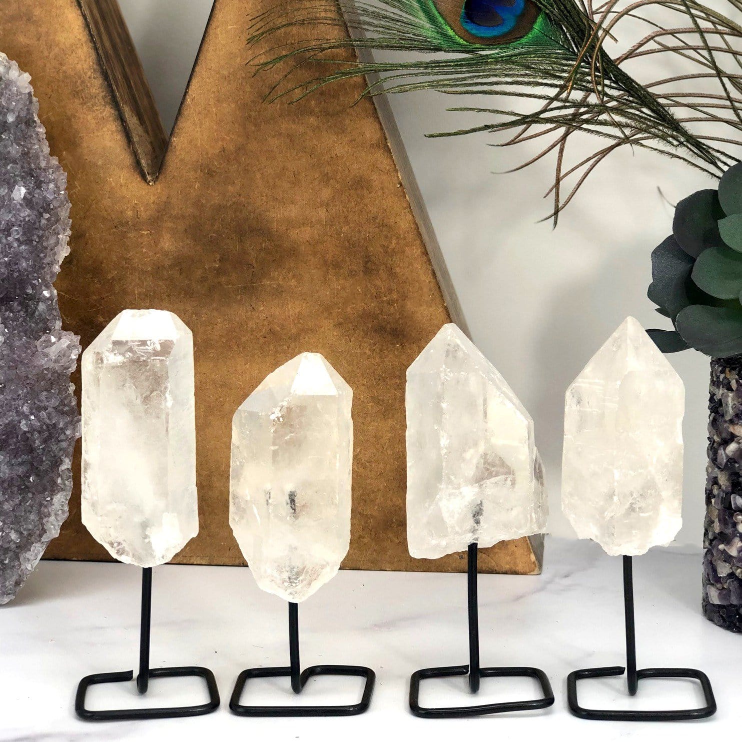 Products Natural Stone Crystal on Metal Stand - 4 on a table