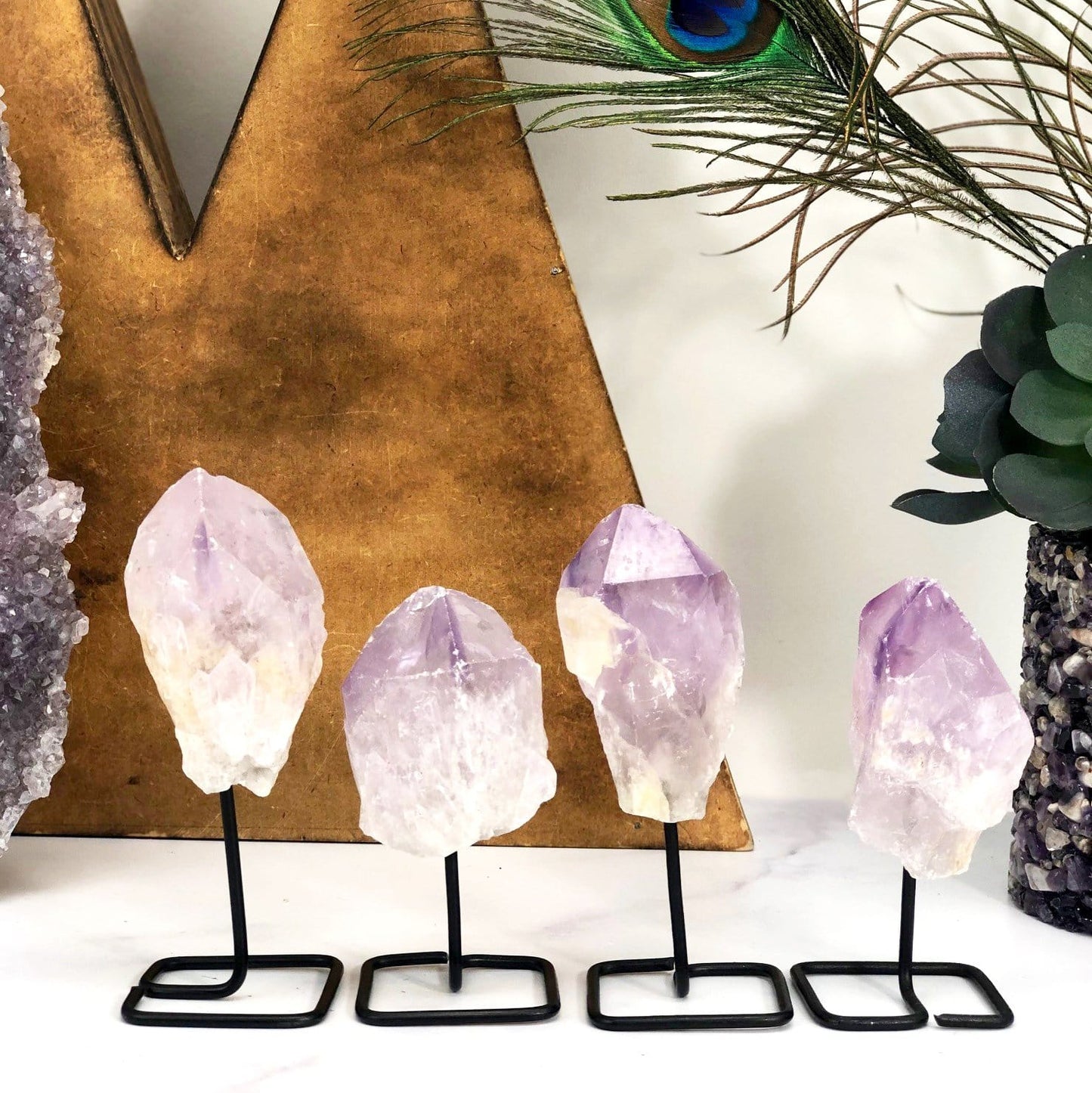 Products Natural Stone Crystal on Metal Stand - 4 on a table
