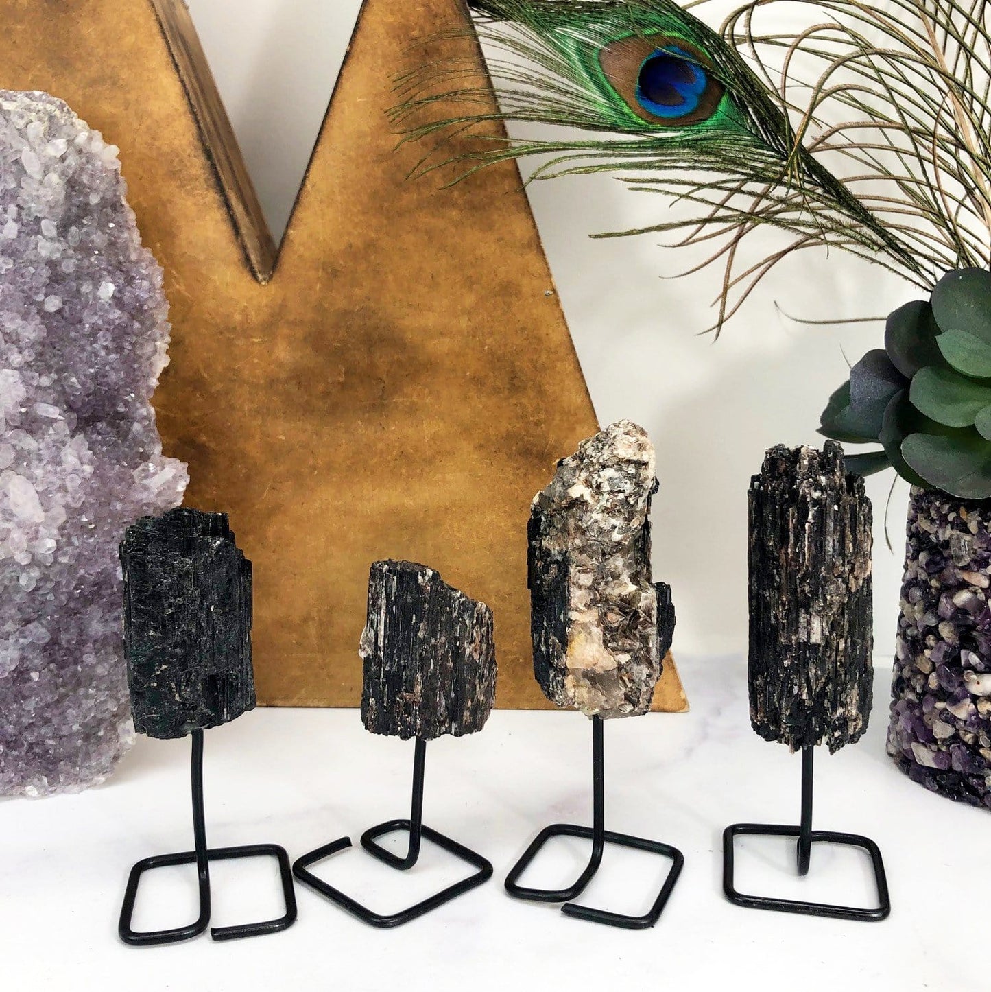 Products Natural Stone Crystal on Metal Stand - 4 tourmaline on a table
