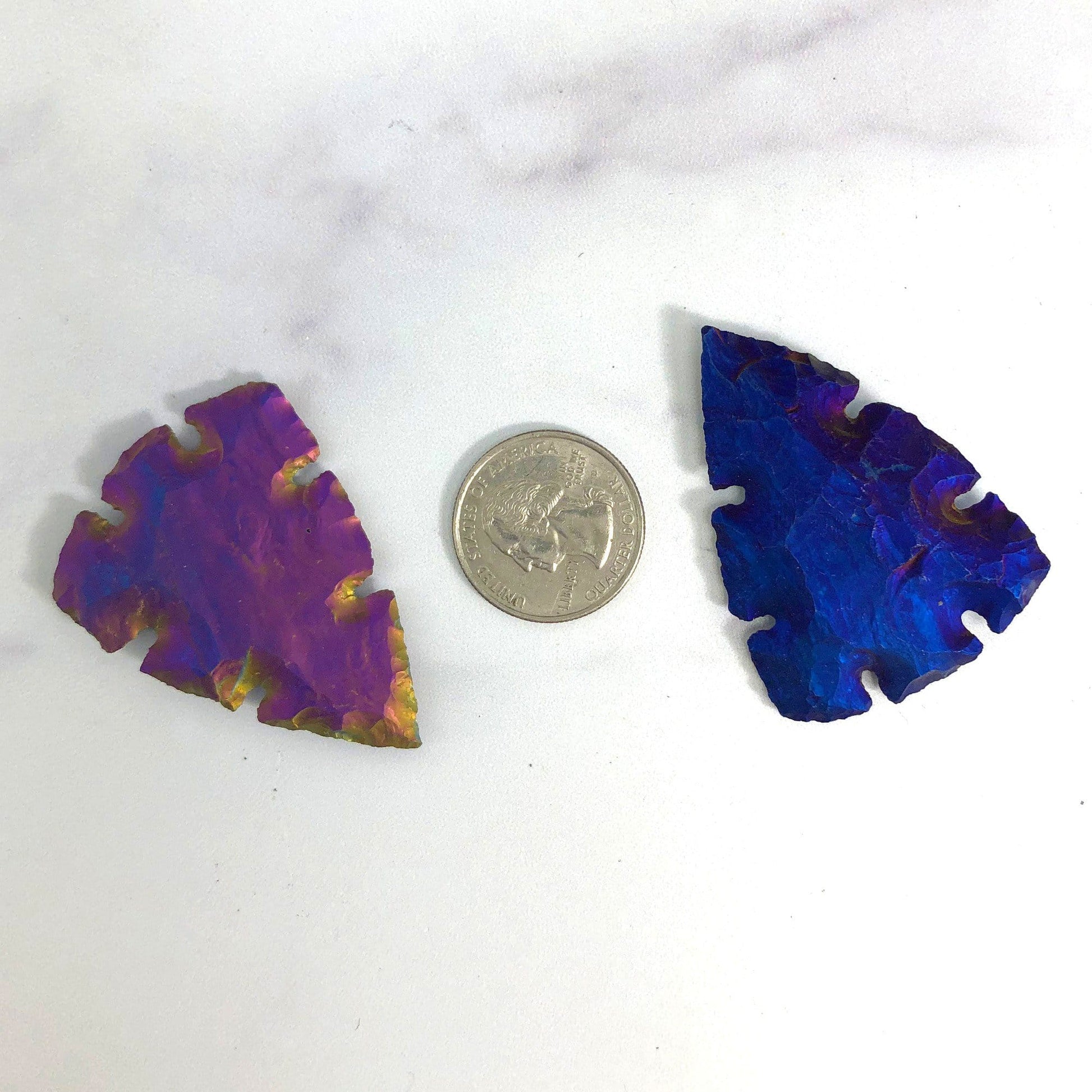 2 arrowheads next to a quarter