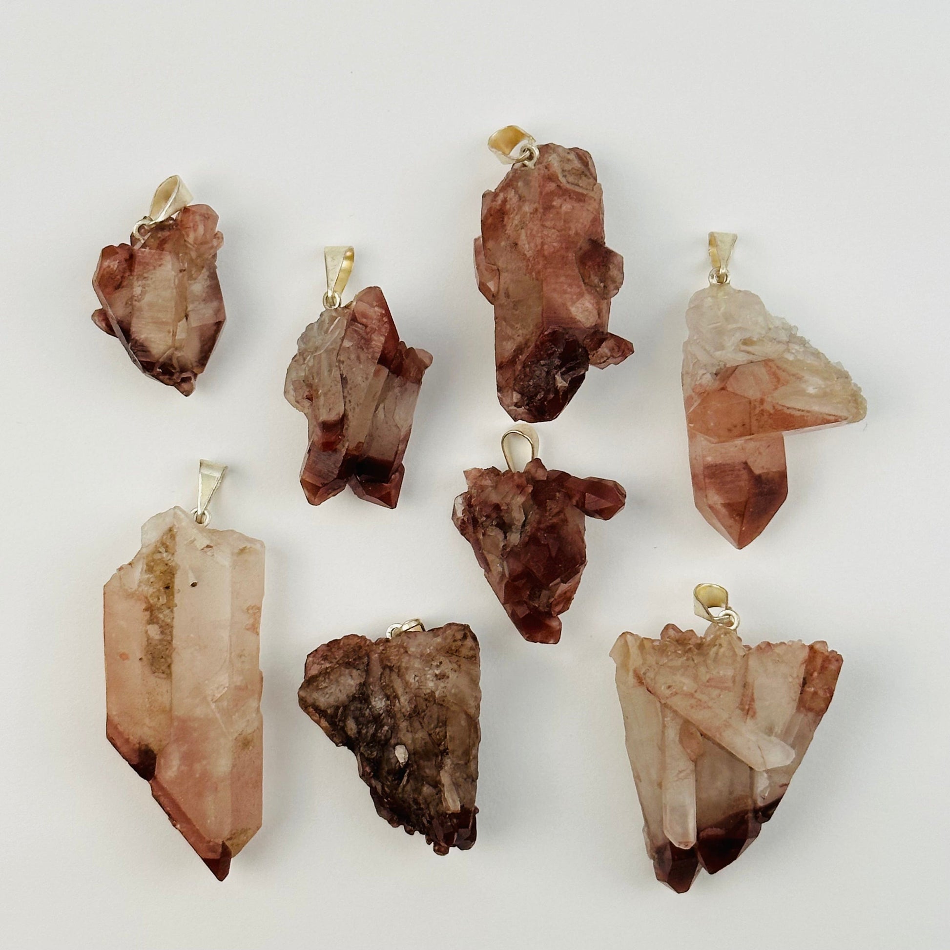 lithium quartz pendants with decorations in the background