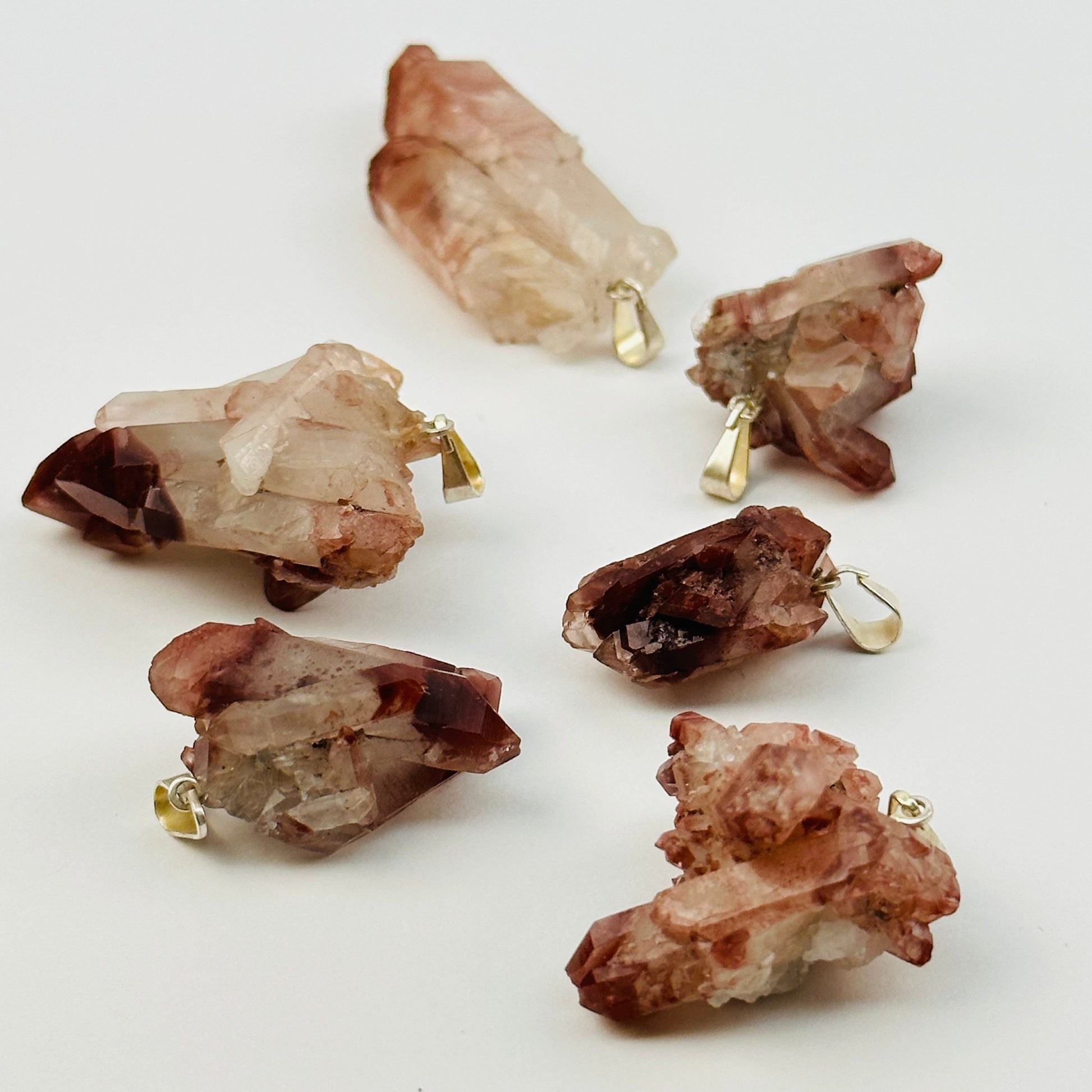 lithium quartz pendants with decorations in the background