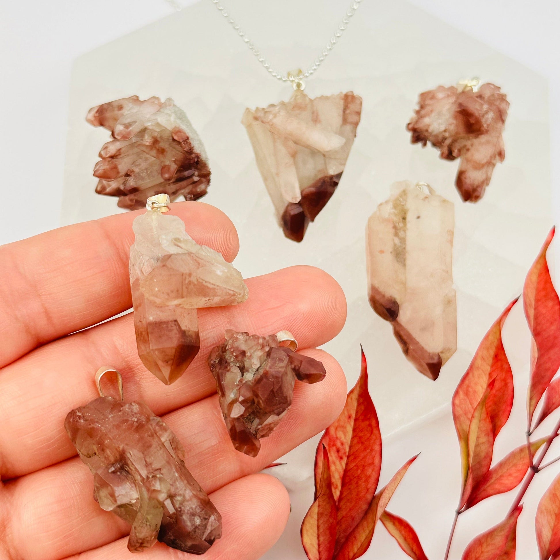 lithium quartz pendants with decorations in the background