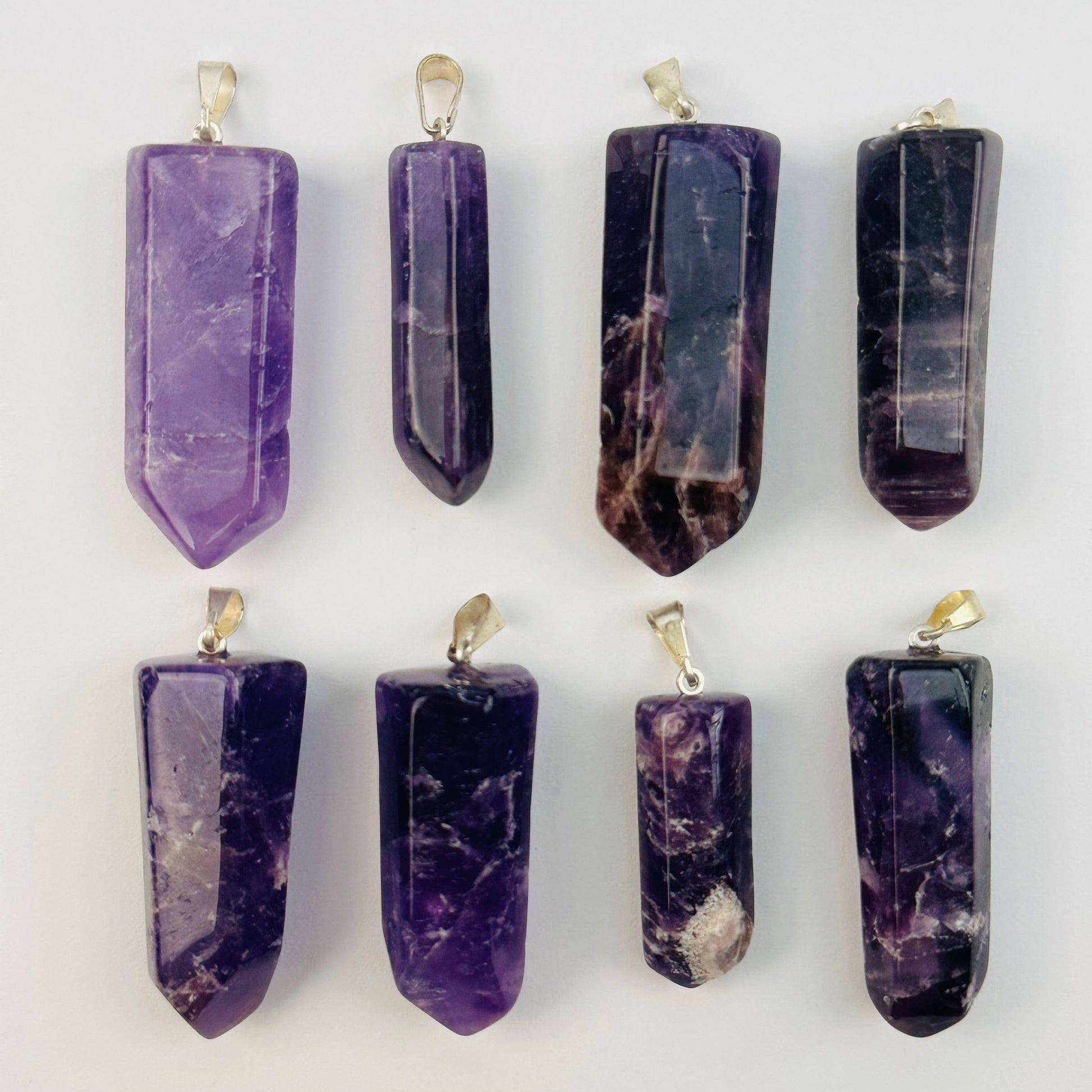 multiple pendants displayed to show the differences in the size and color shades 