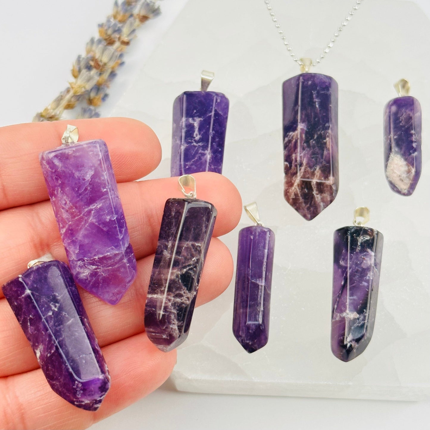 Amethyst Crystal Polished Point Pendant Charm - Silver Bail in hand for size reference 
