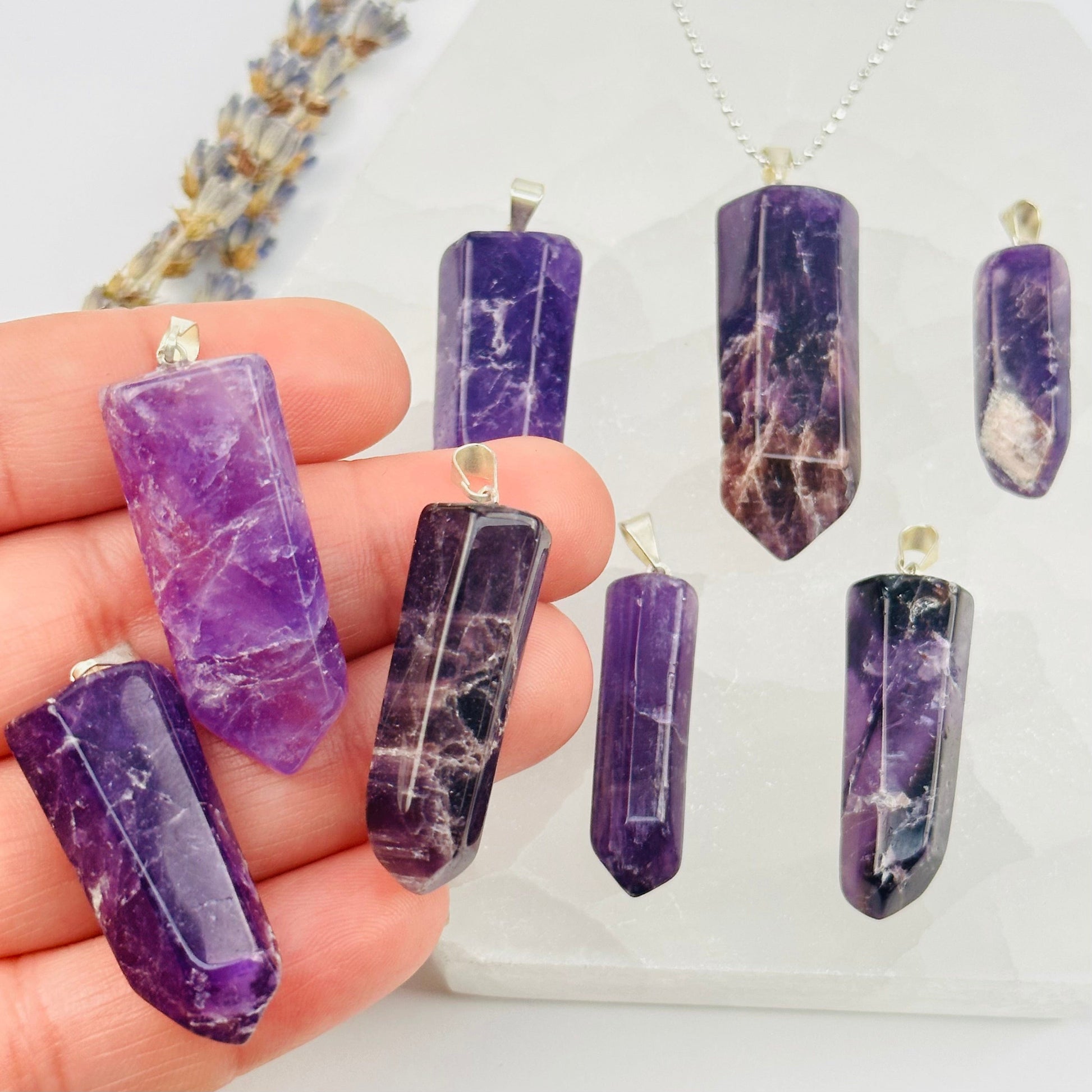 Amethyst Crystal Polished Point Pendant Charm - Silver Bail in hand for size reference 