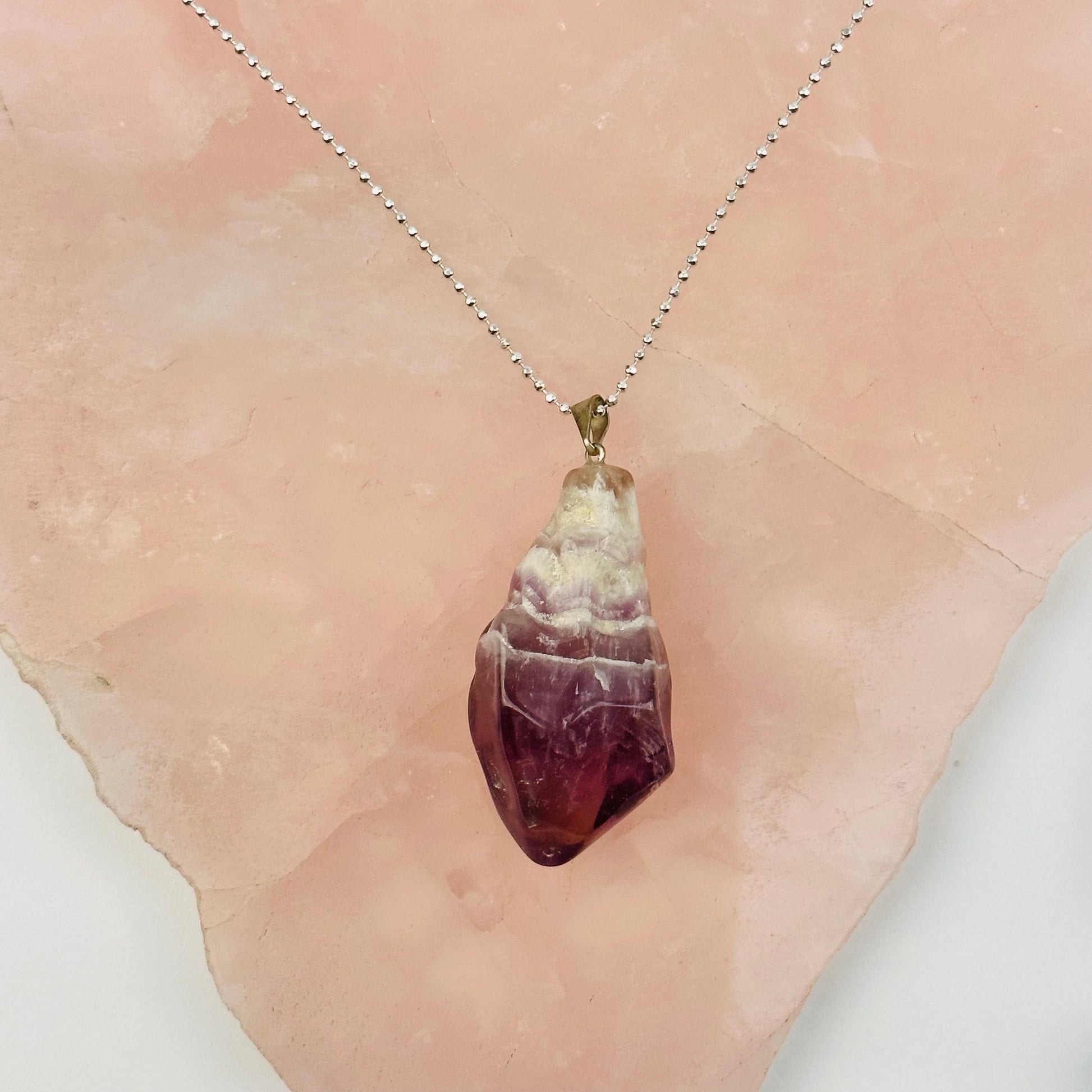pendant displayed to show how it hangs on a necklace 