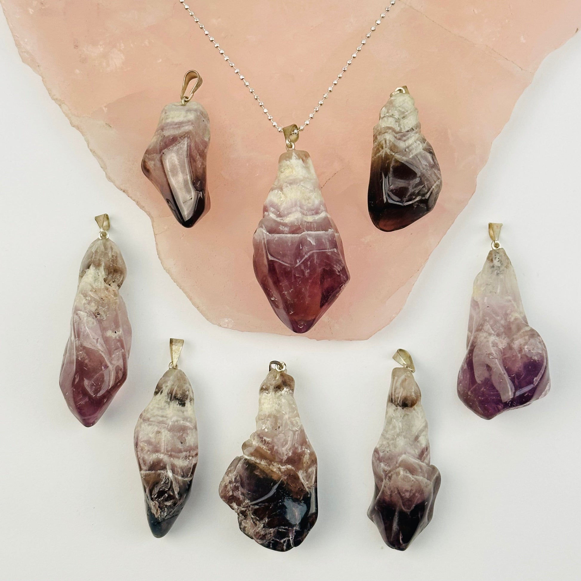 multiple pendants displayed to show the differences in the sizes and color shades 