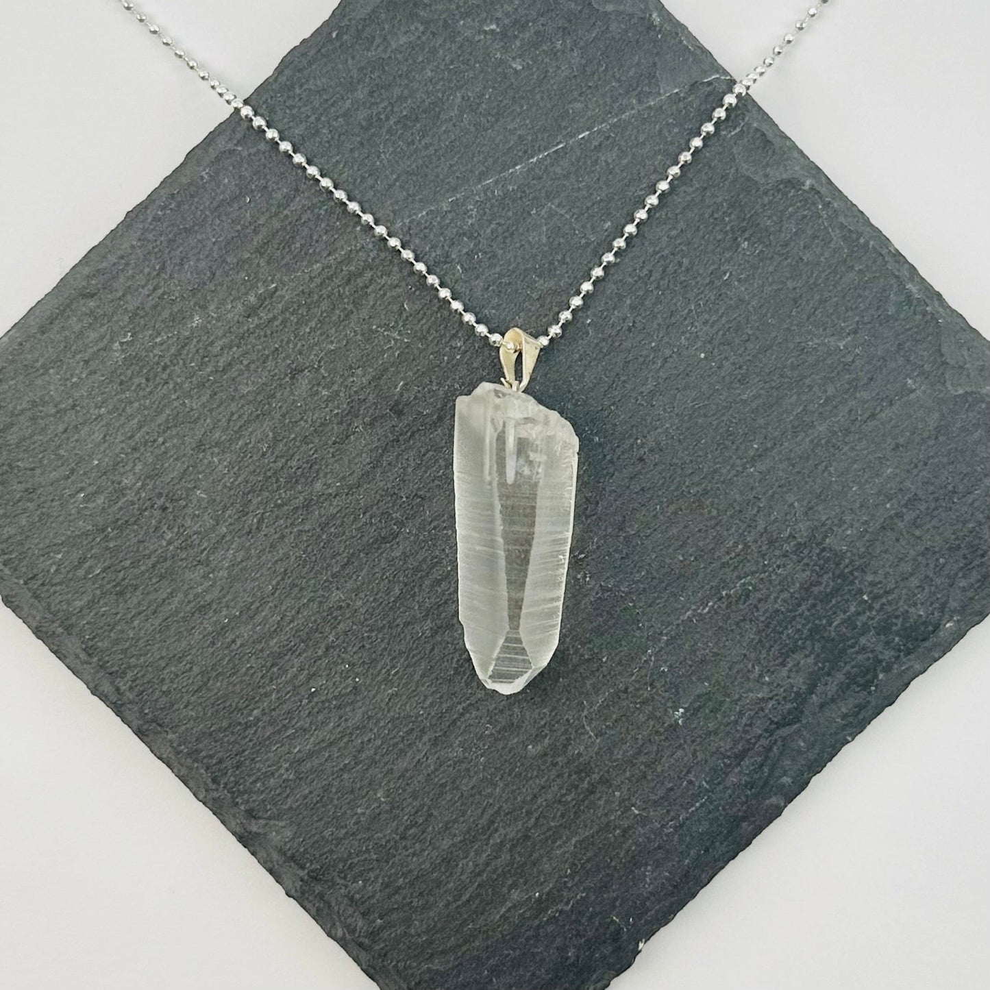 pendant displayed on necklace to show how it hangs 