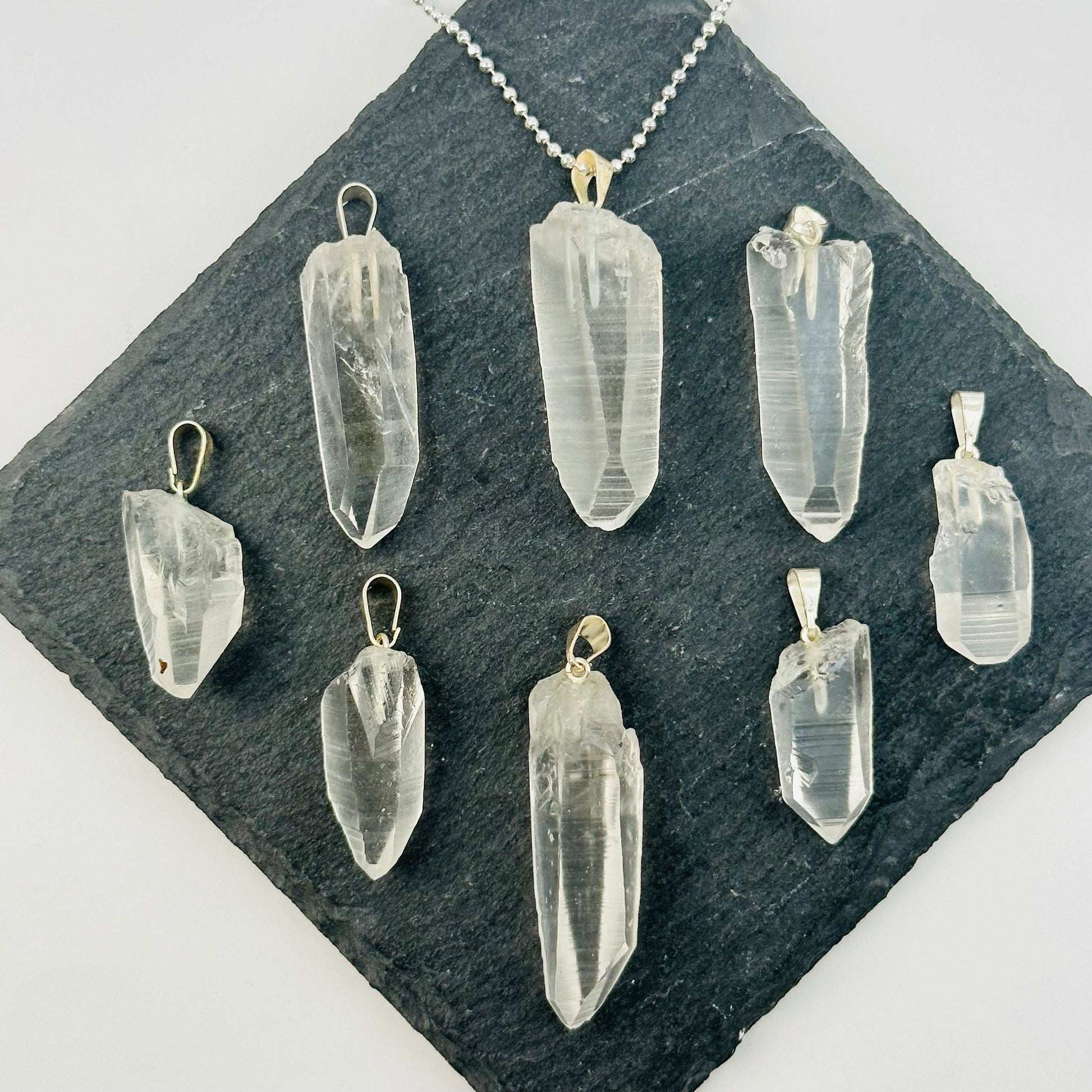 multiple pendants displayed to show the differences in the sizes 