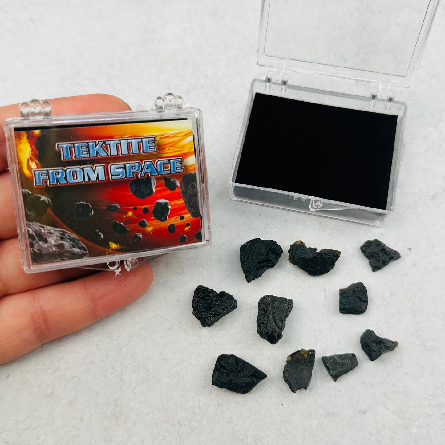 tektite from space comes in a small clear box 
