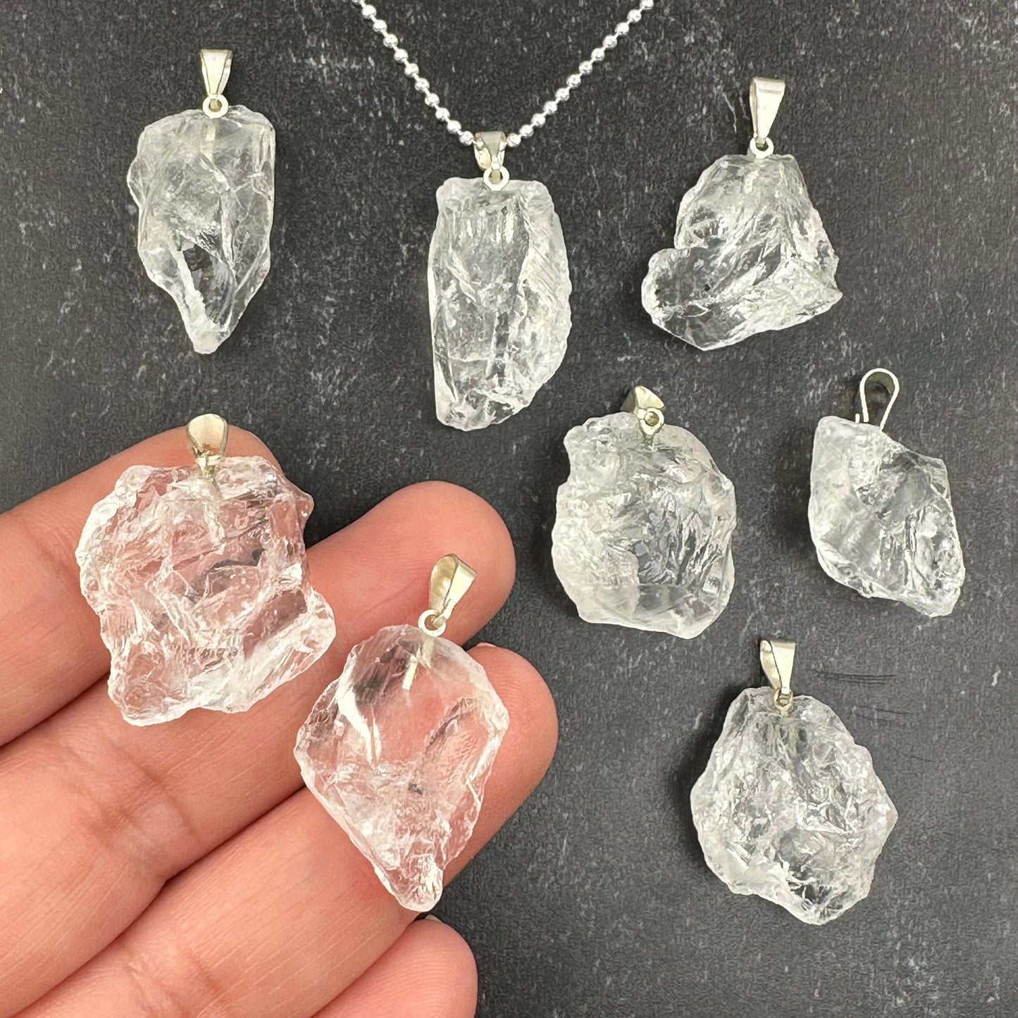 Rough Natural Crystal Stone Pendant - lemurian - in hand for size reference 