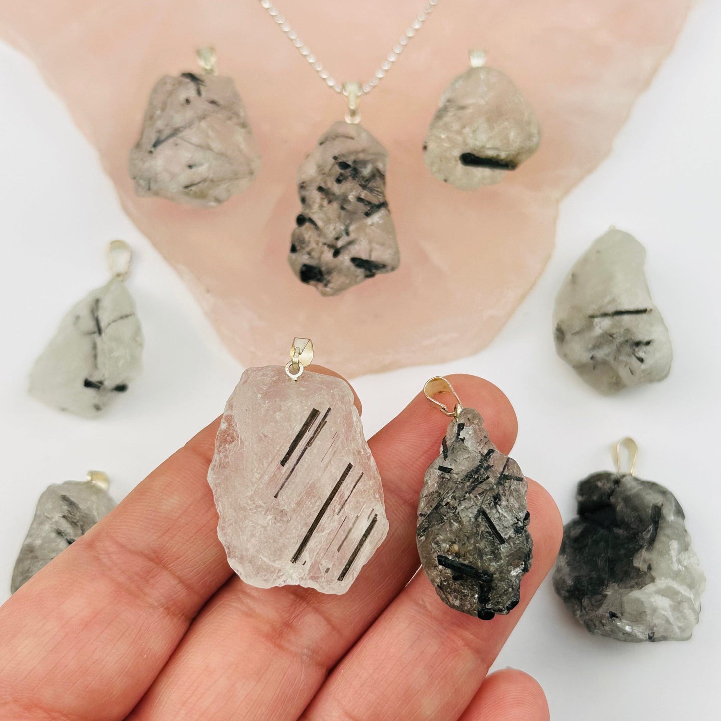 Rough Natural Crystal Stone Pendant - rutilated quartz - in hand for size reference
