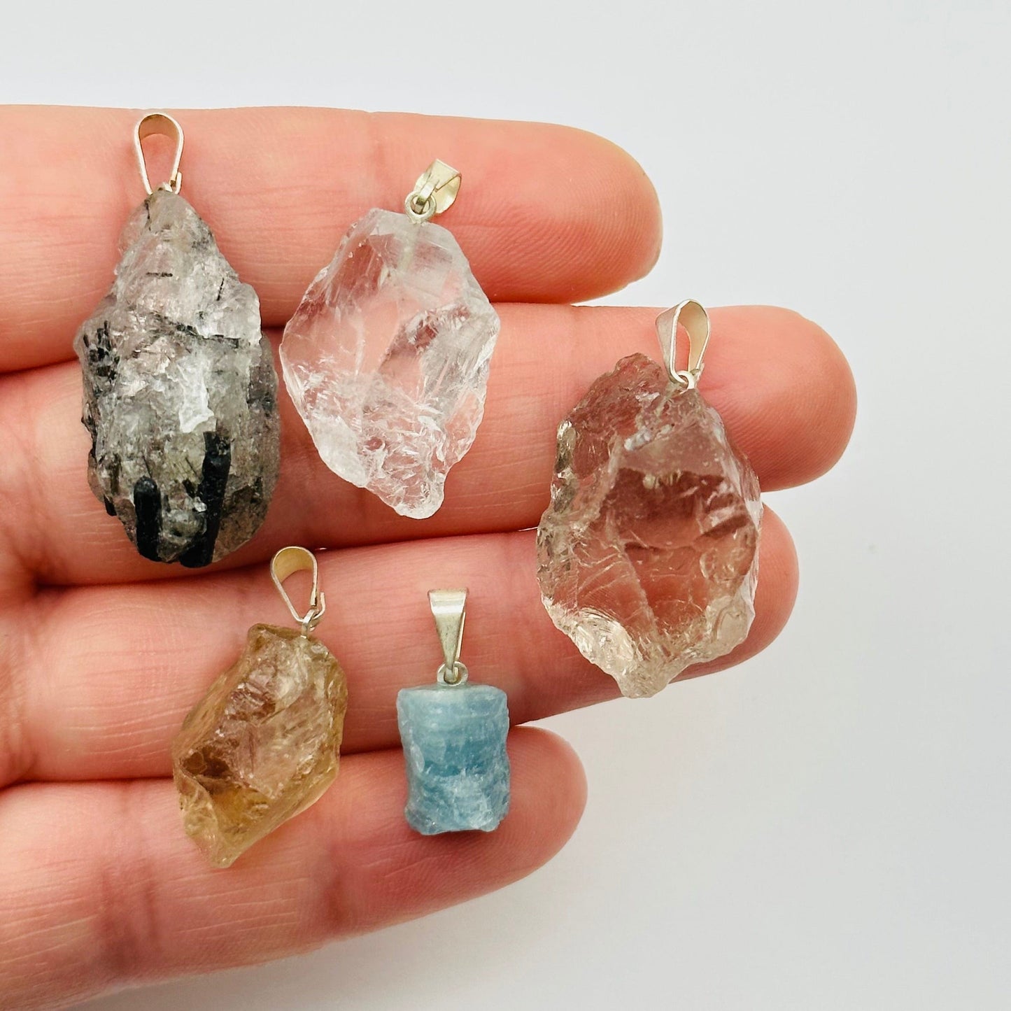 pendants in hand for size reference 