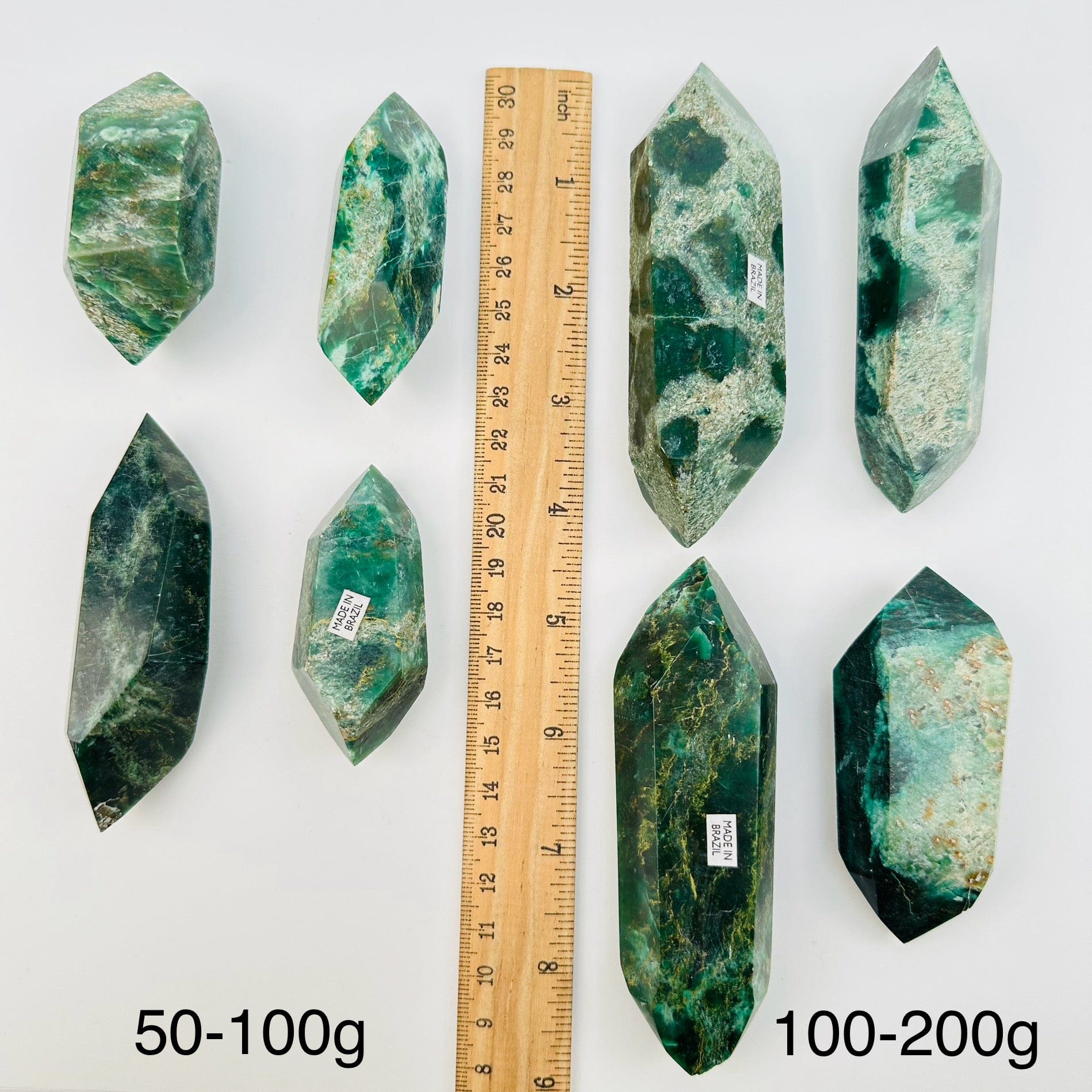 crystals sold by weight. displayed next to a ruler for size reference 