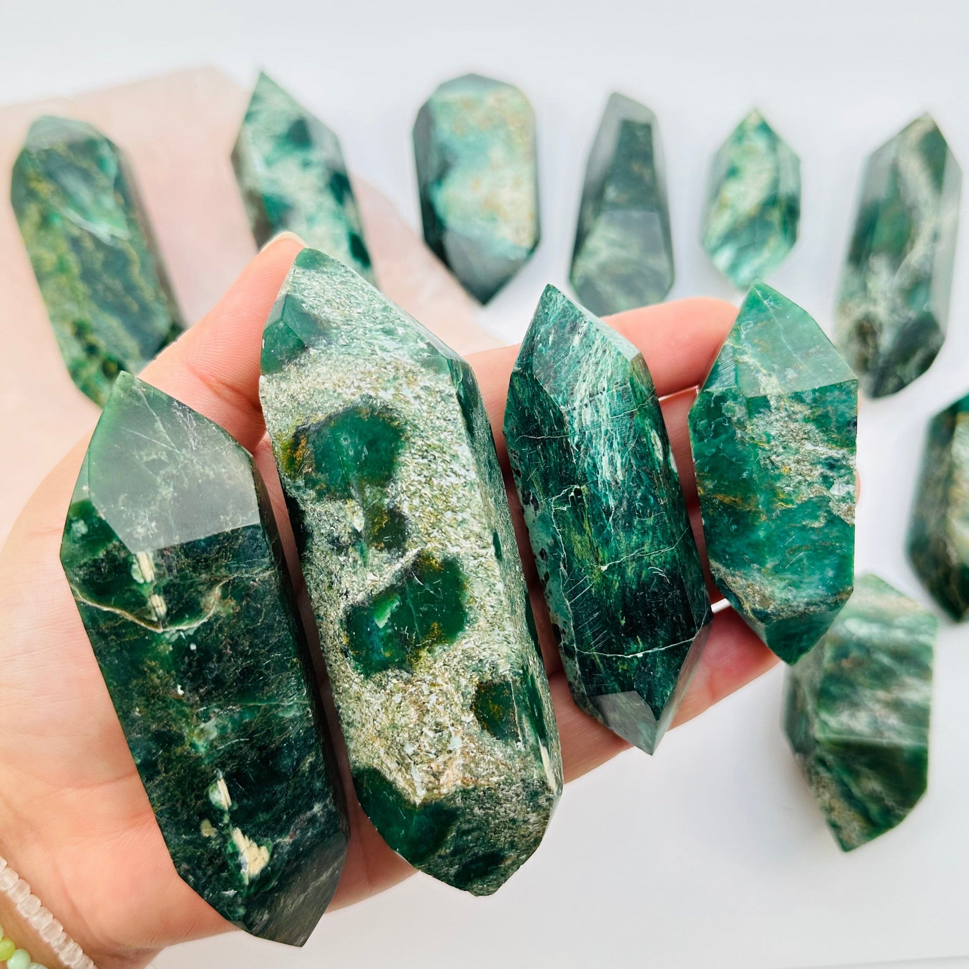 close up of the details on these double terminated fuchsite crystals 