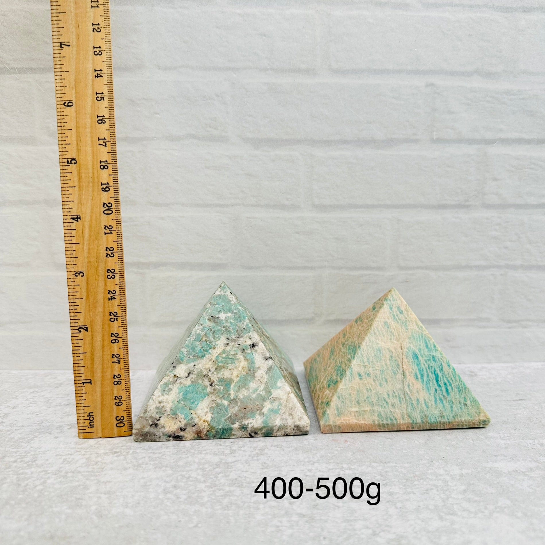 Amazonite Crystal Pyramids - By Weight - next to a ruler for size reference 