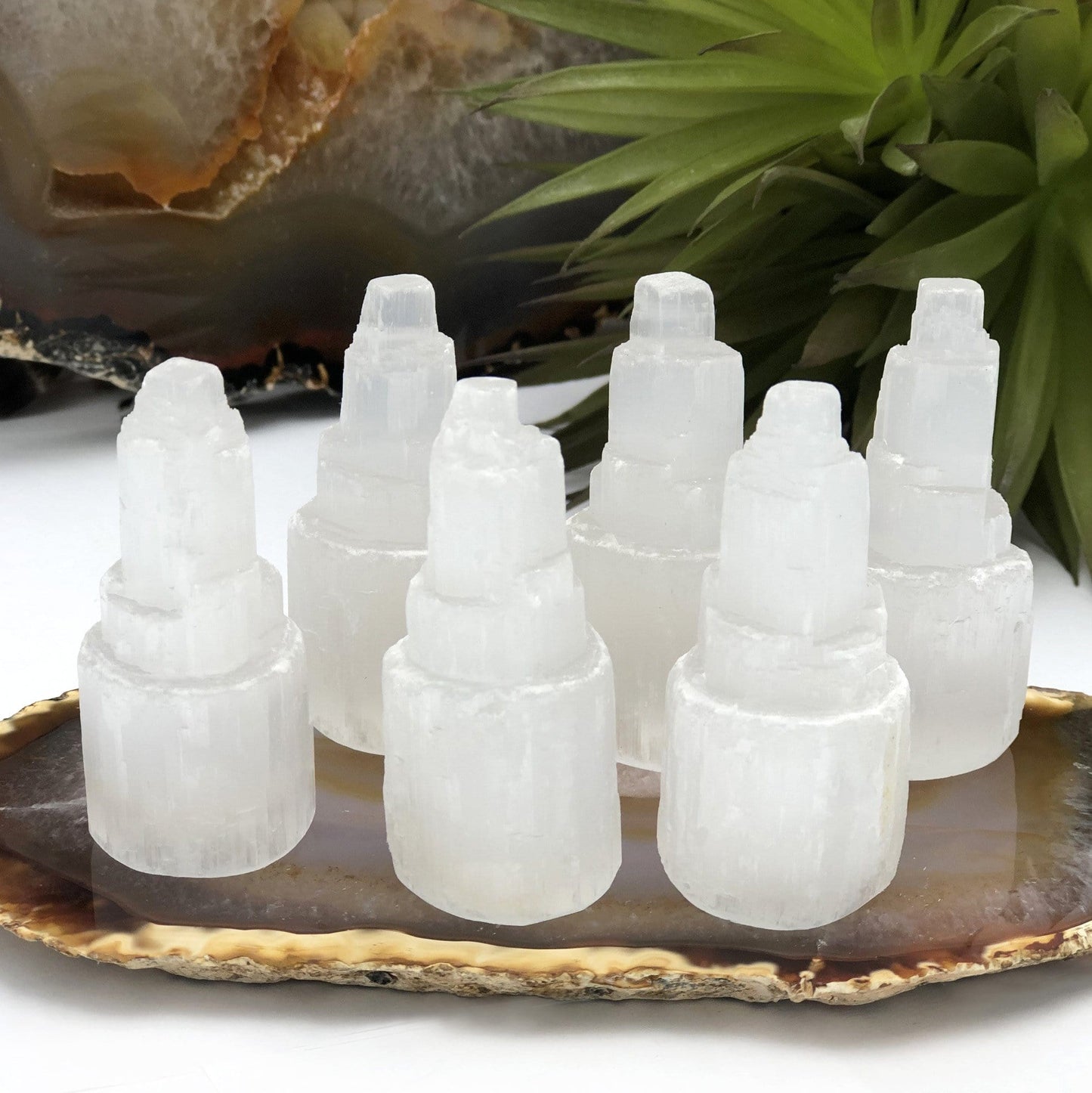 many selenite raw crystal towers on display for possible variations