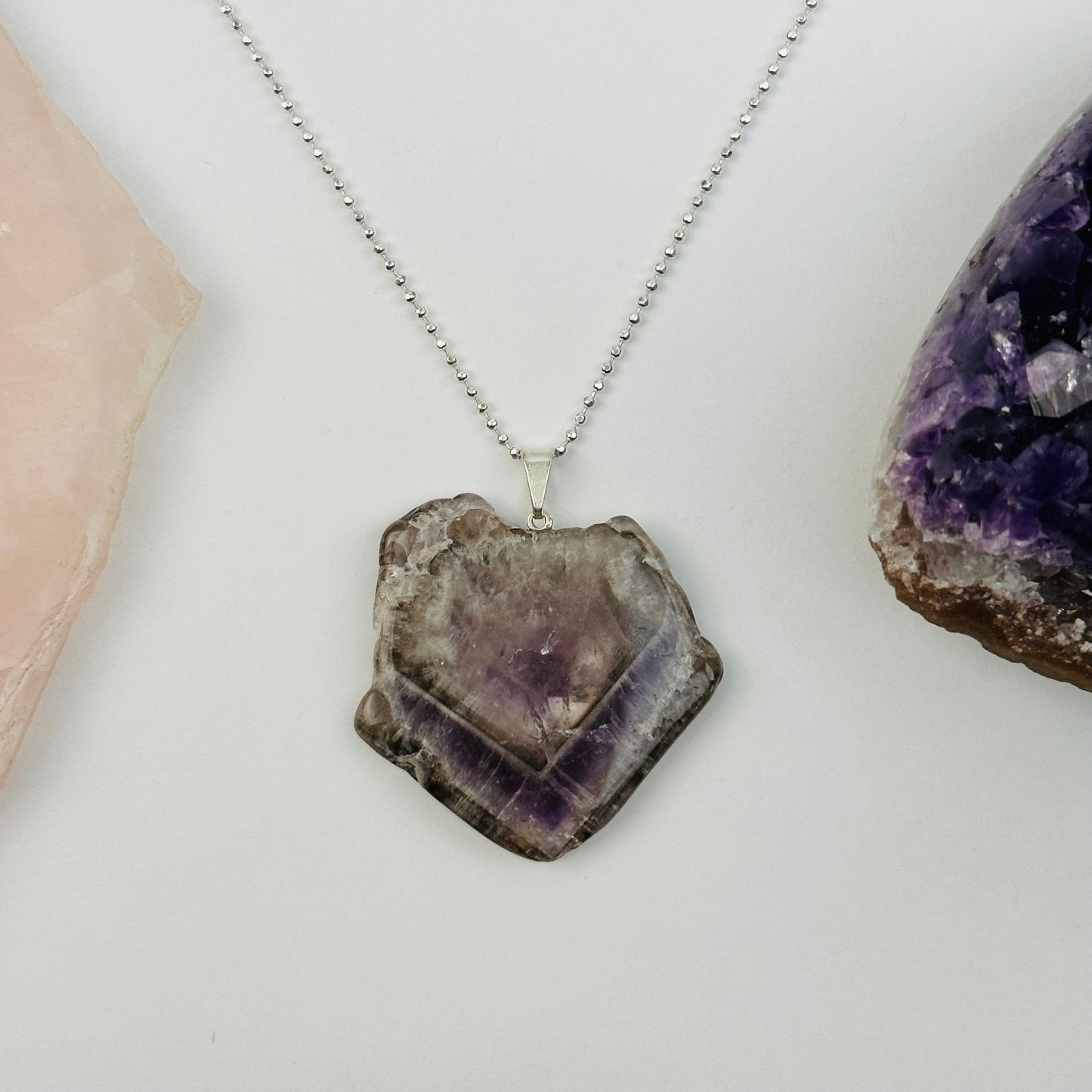 pendant displayed on a necklace to show how it hangs 