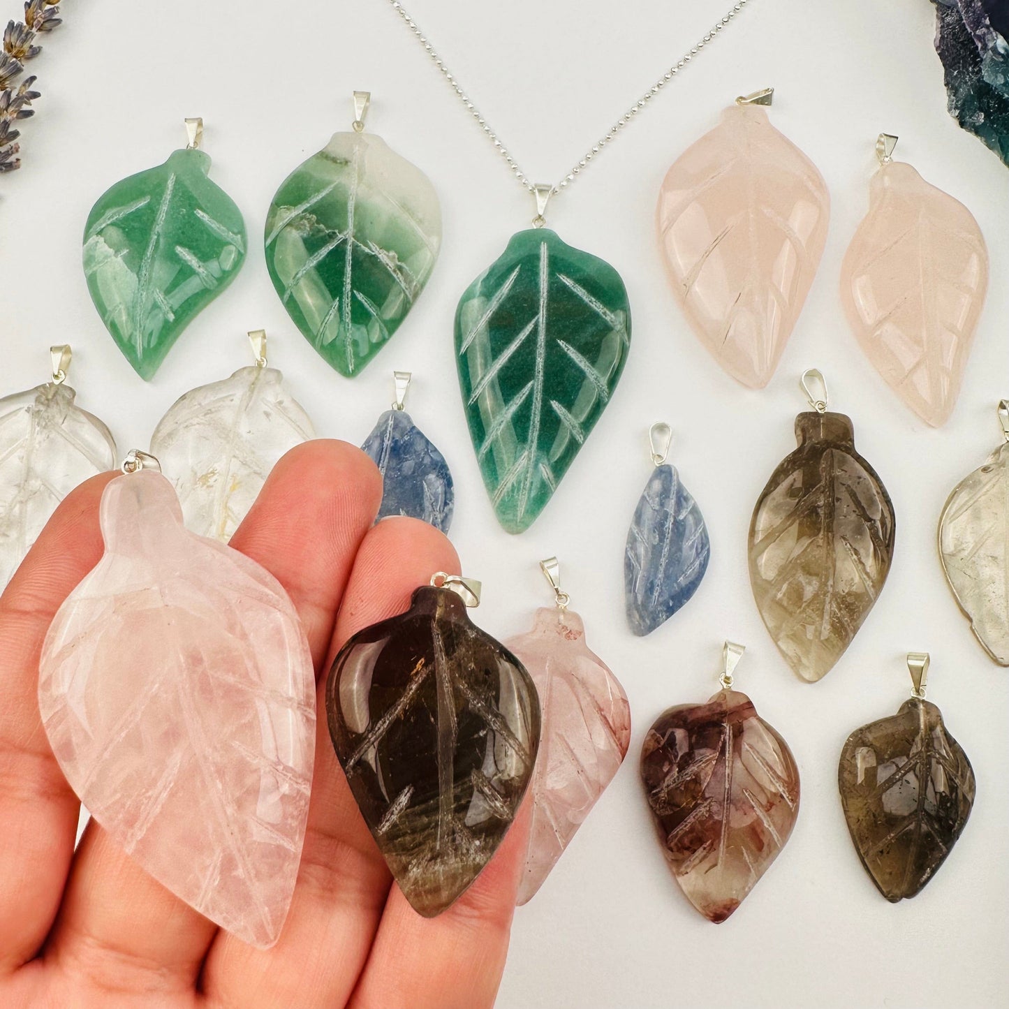 Crystal Gemstone Leaf Polished Pendant - Silver Bail in hand for size reference 