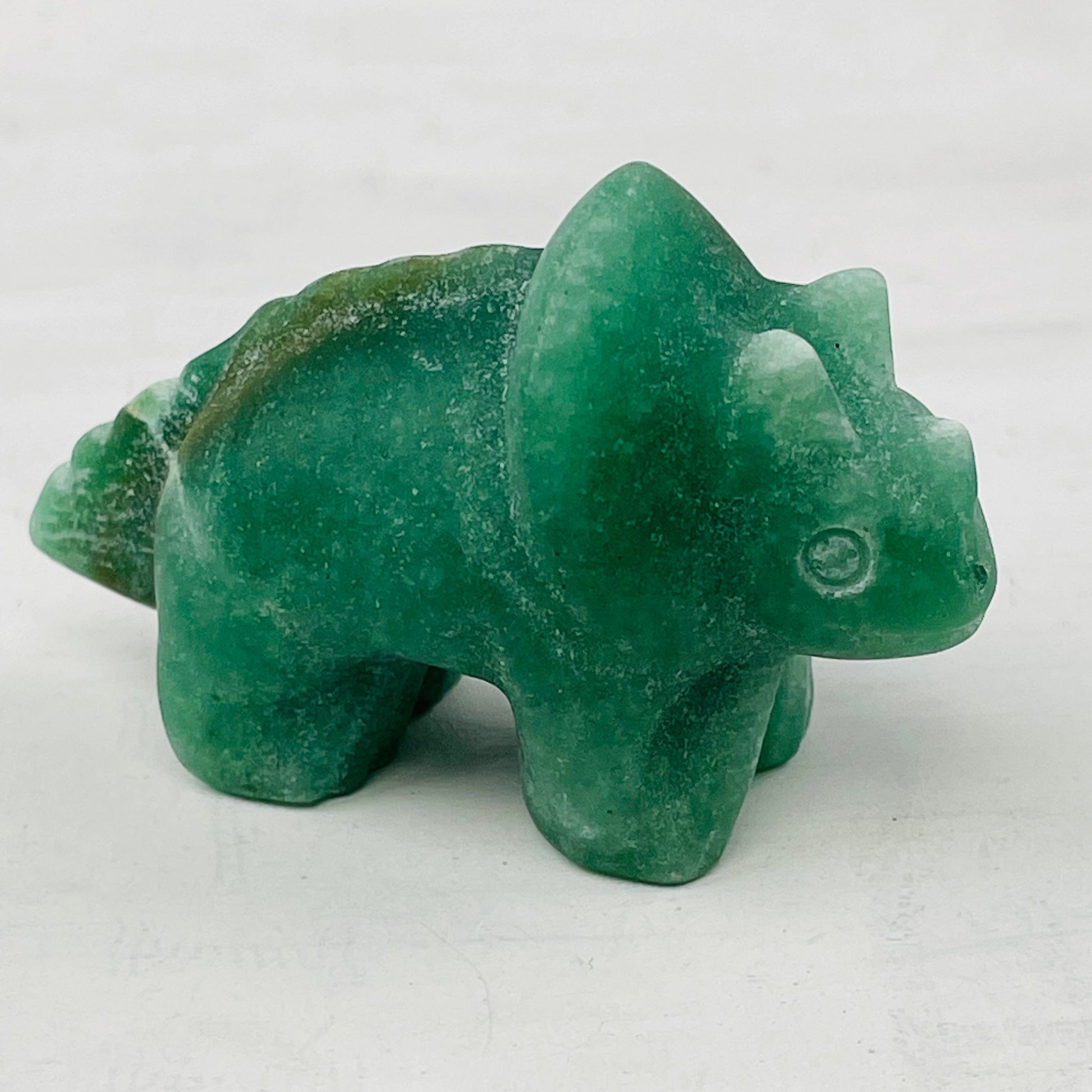 close up of the details on the carved gemstone dinosaur