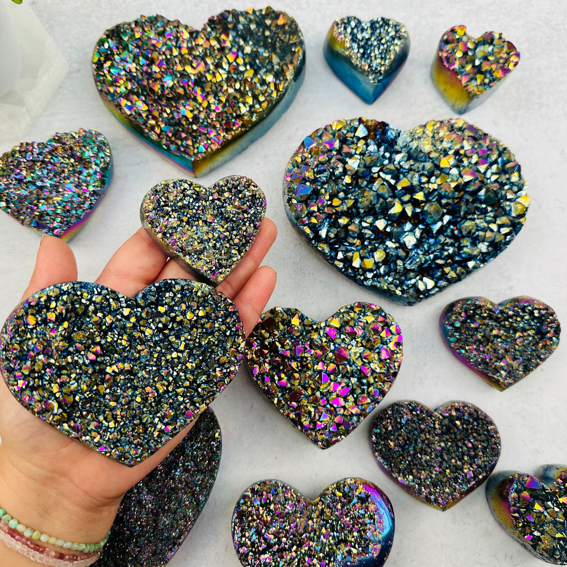 Amethyst Druzy Heart with Rainbow Titanium Finish in hand for size reference 