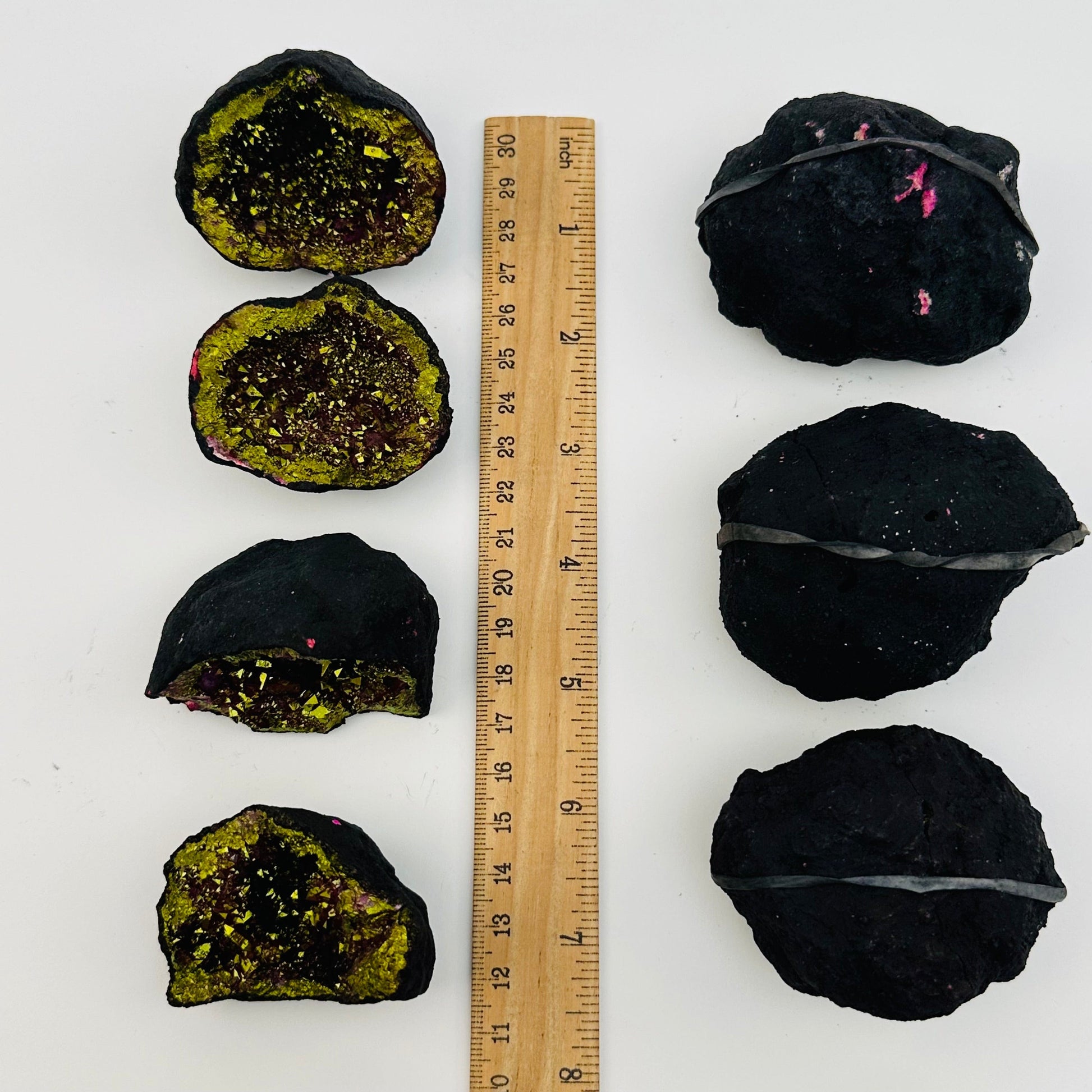 geodes next to a ruler for size reference 
