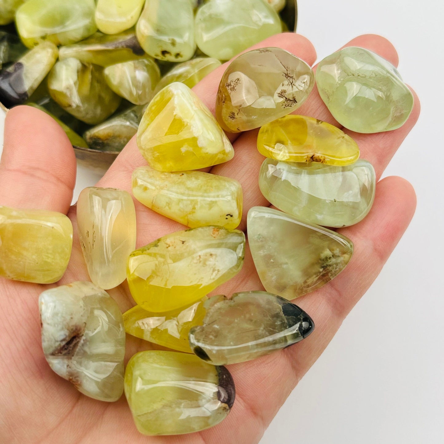 tumbled stones in hand for size reference 