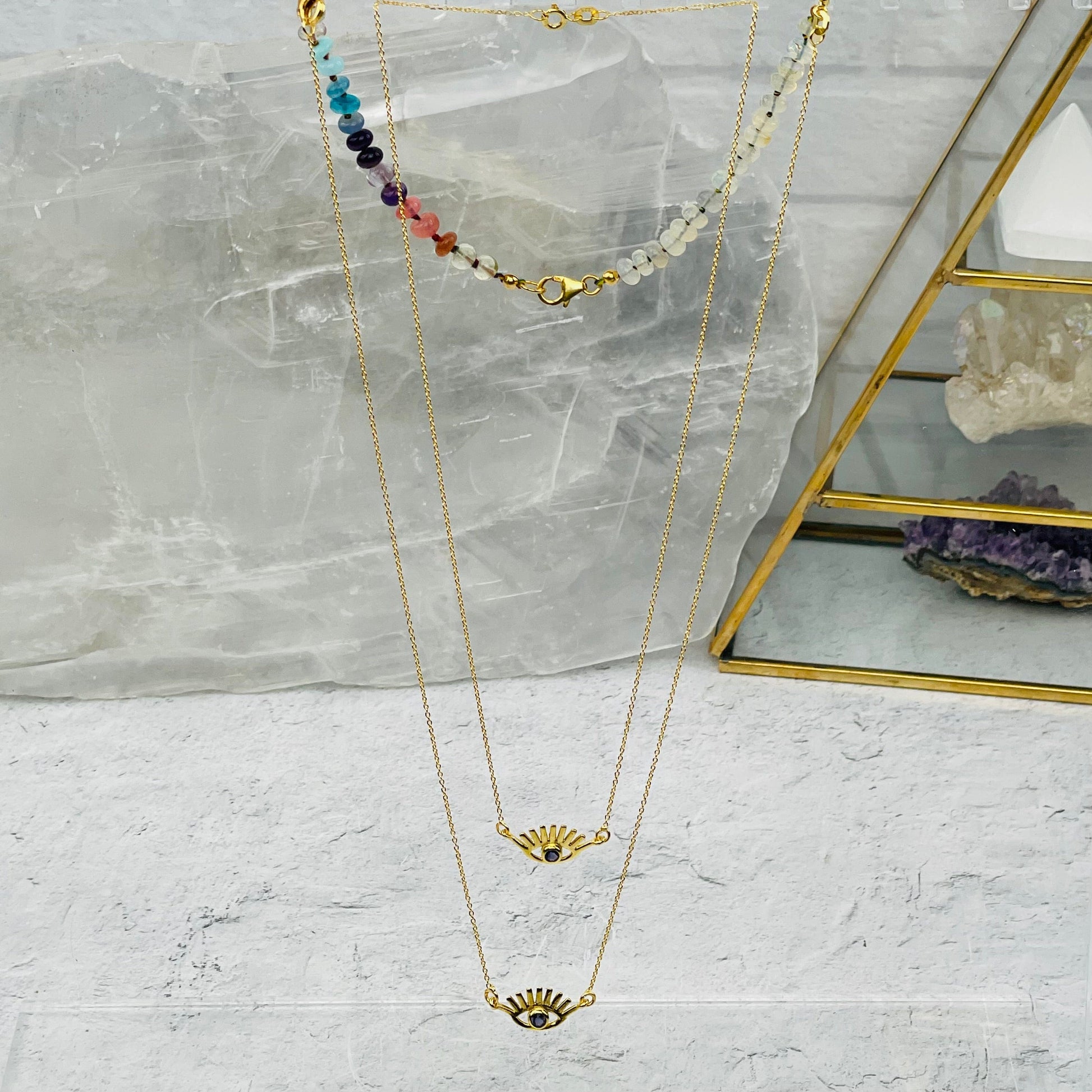 necklace displayed with and without the extender 