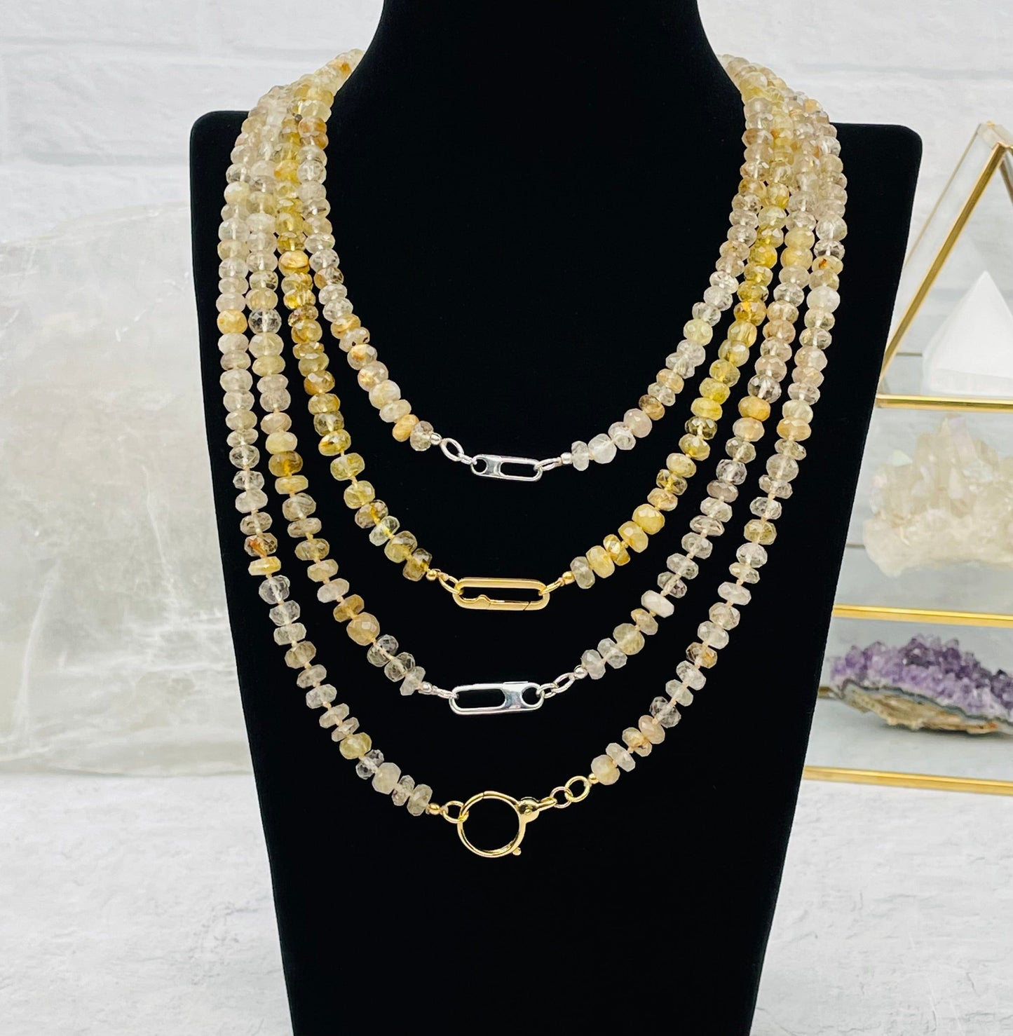 necklaces displayed to show the differences in the necklace clasp 