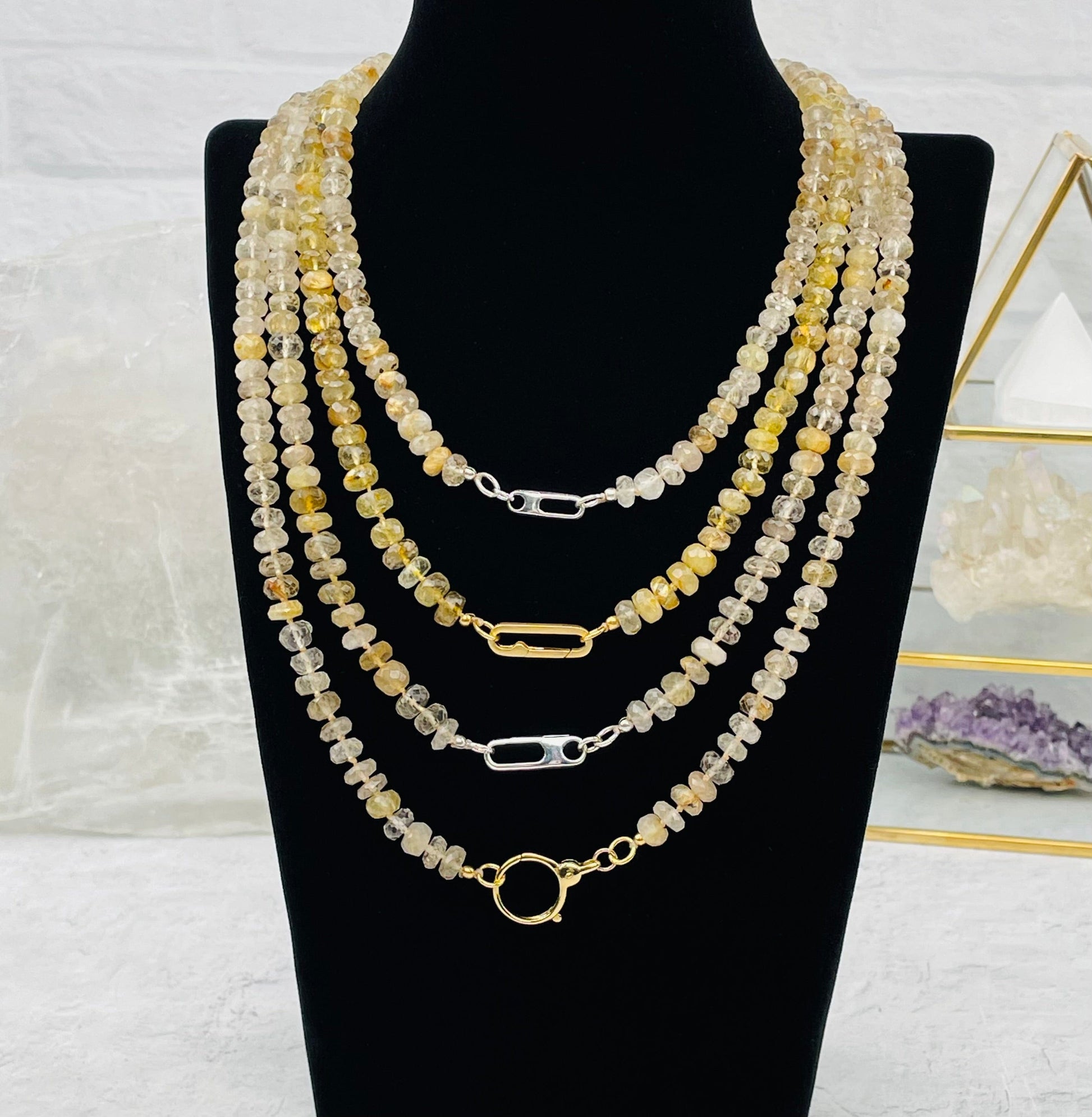 necklaces displayed to show the differences in the necklace clasp 