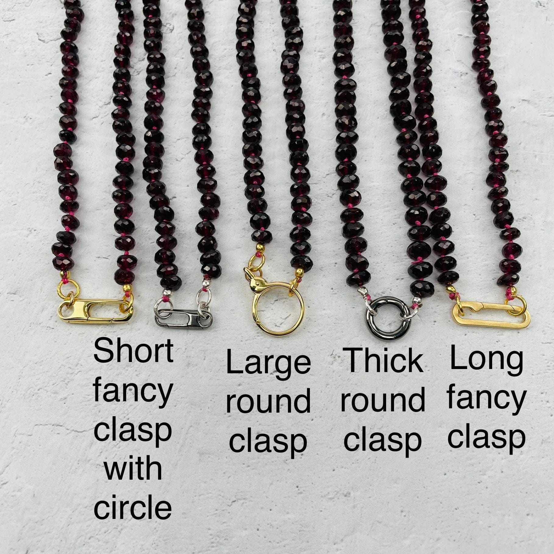 close up of the fancy lobster clasp and the name 