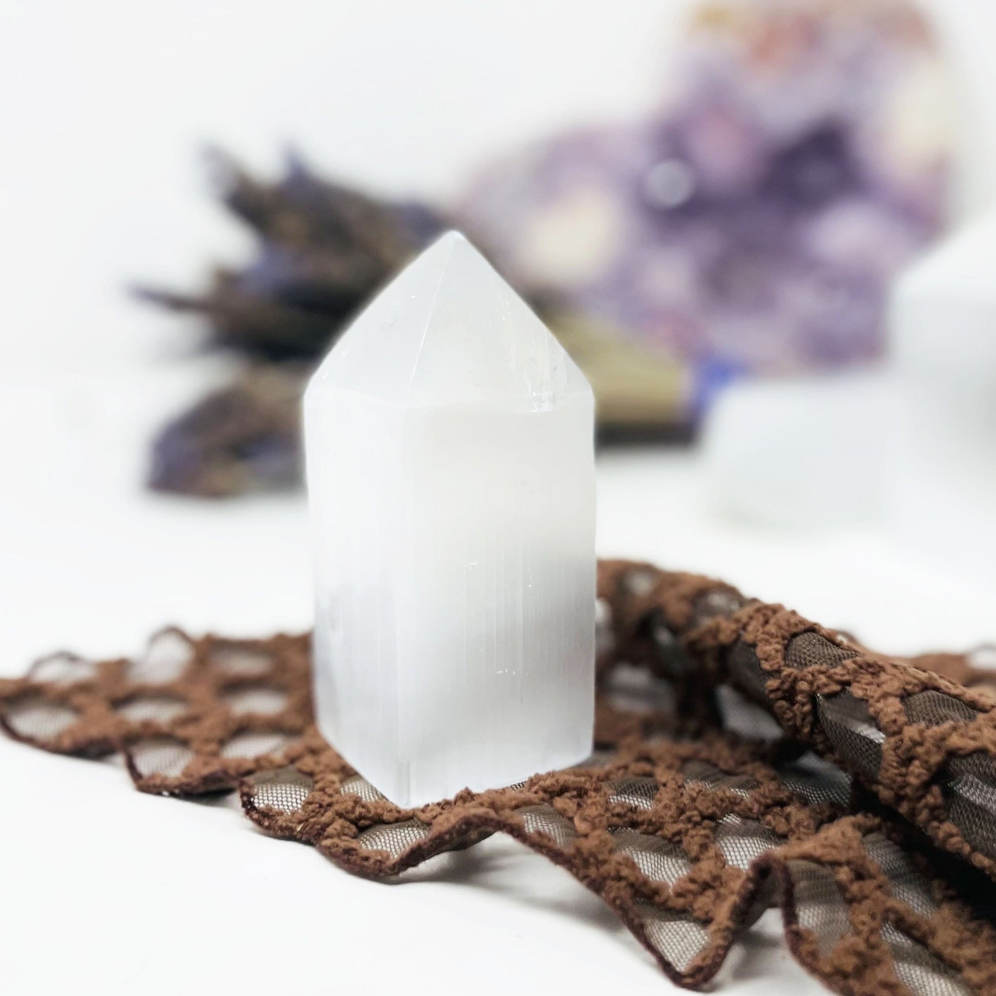 close up of selenite square point on display for details