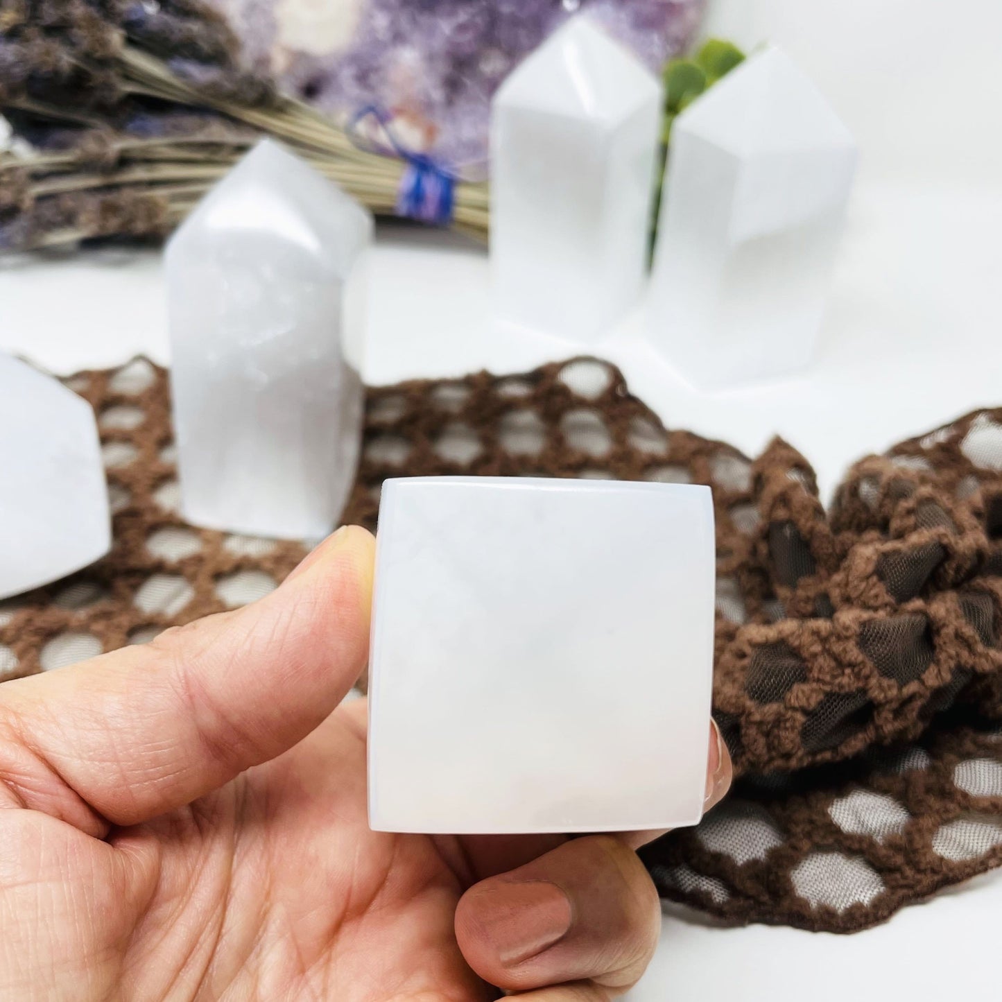 bottom of selenite square point in hand