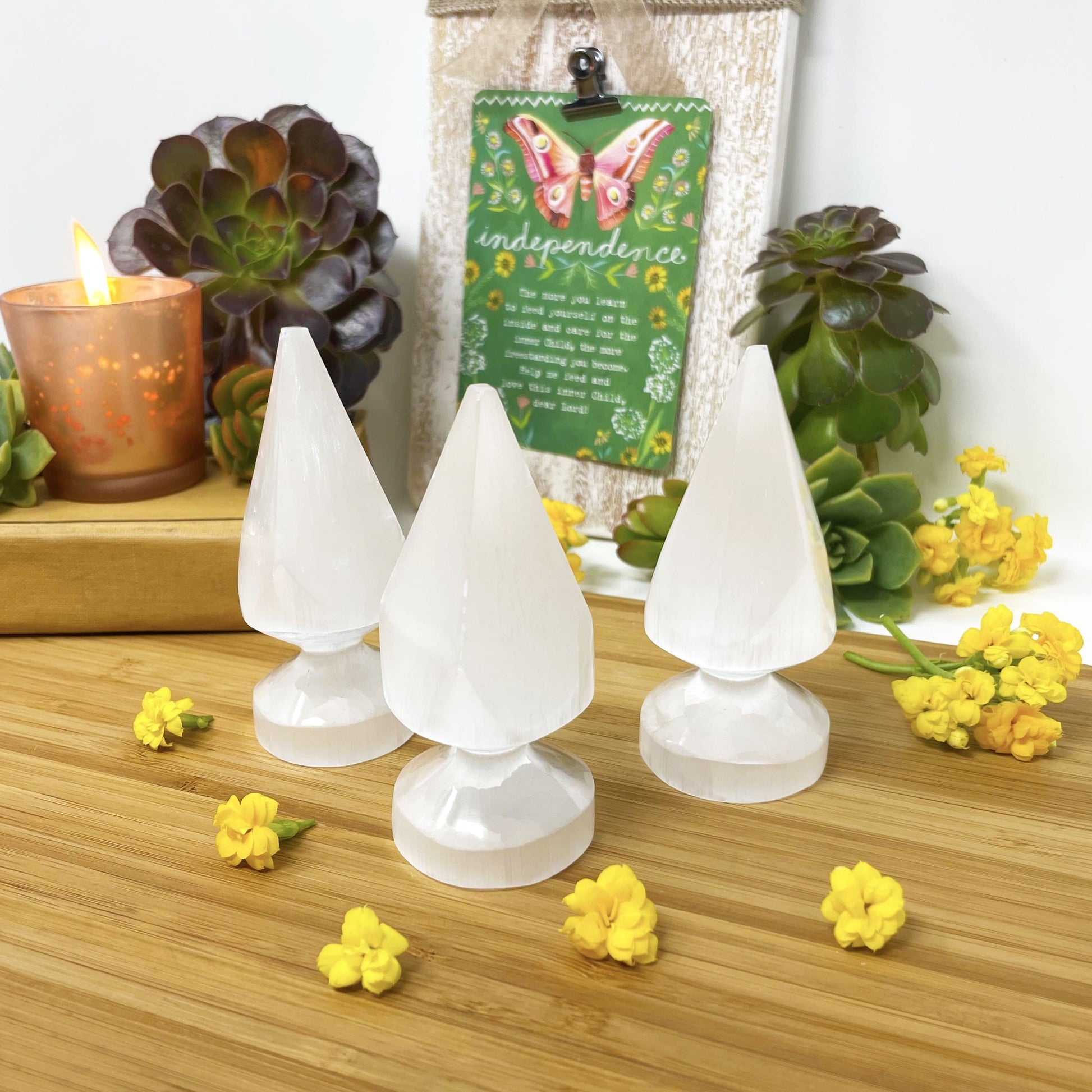 three selenite round spear tips on display for possible variations