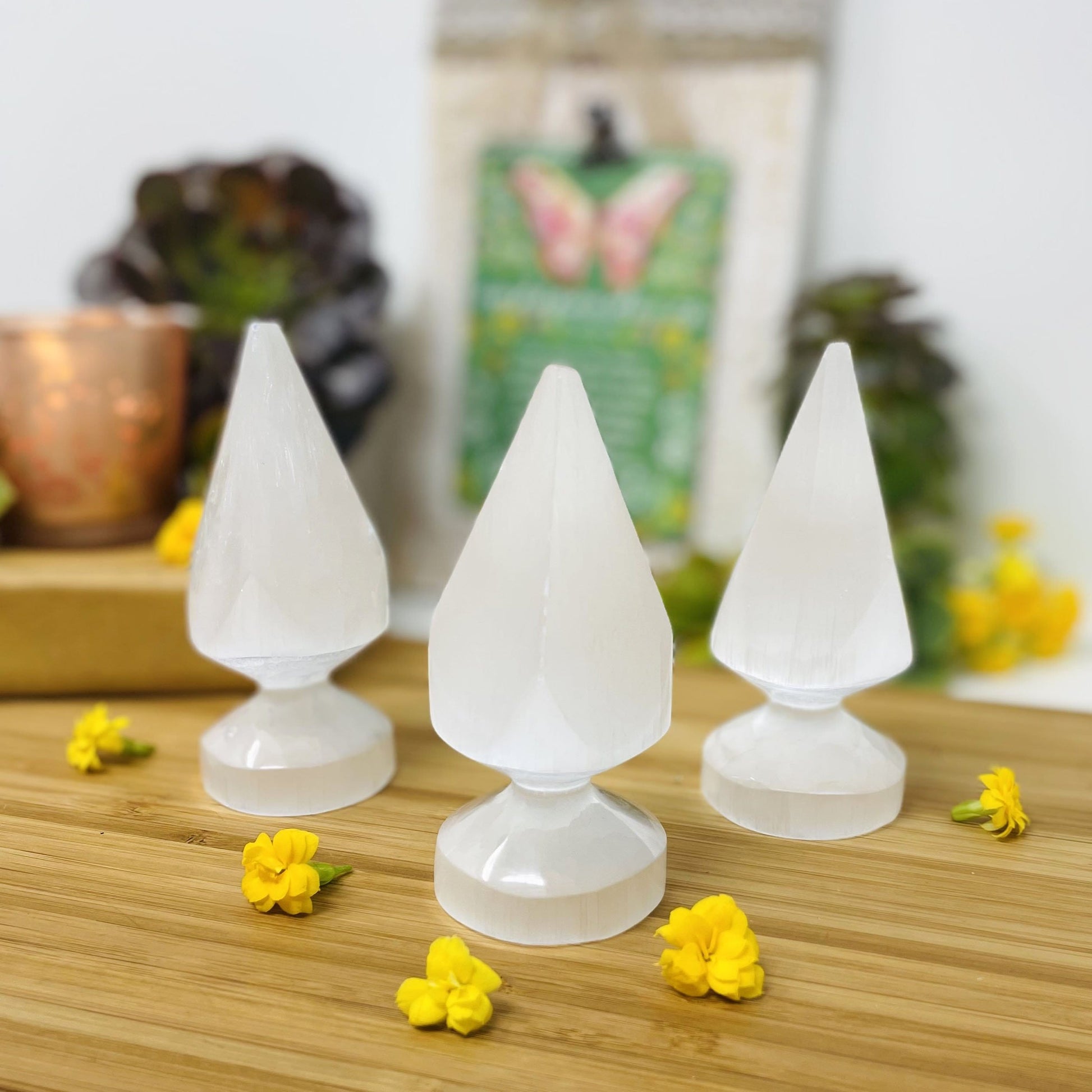 three selenite round spear tips on display for possible variations