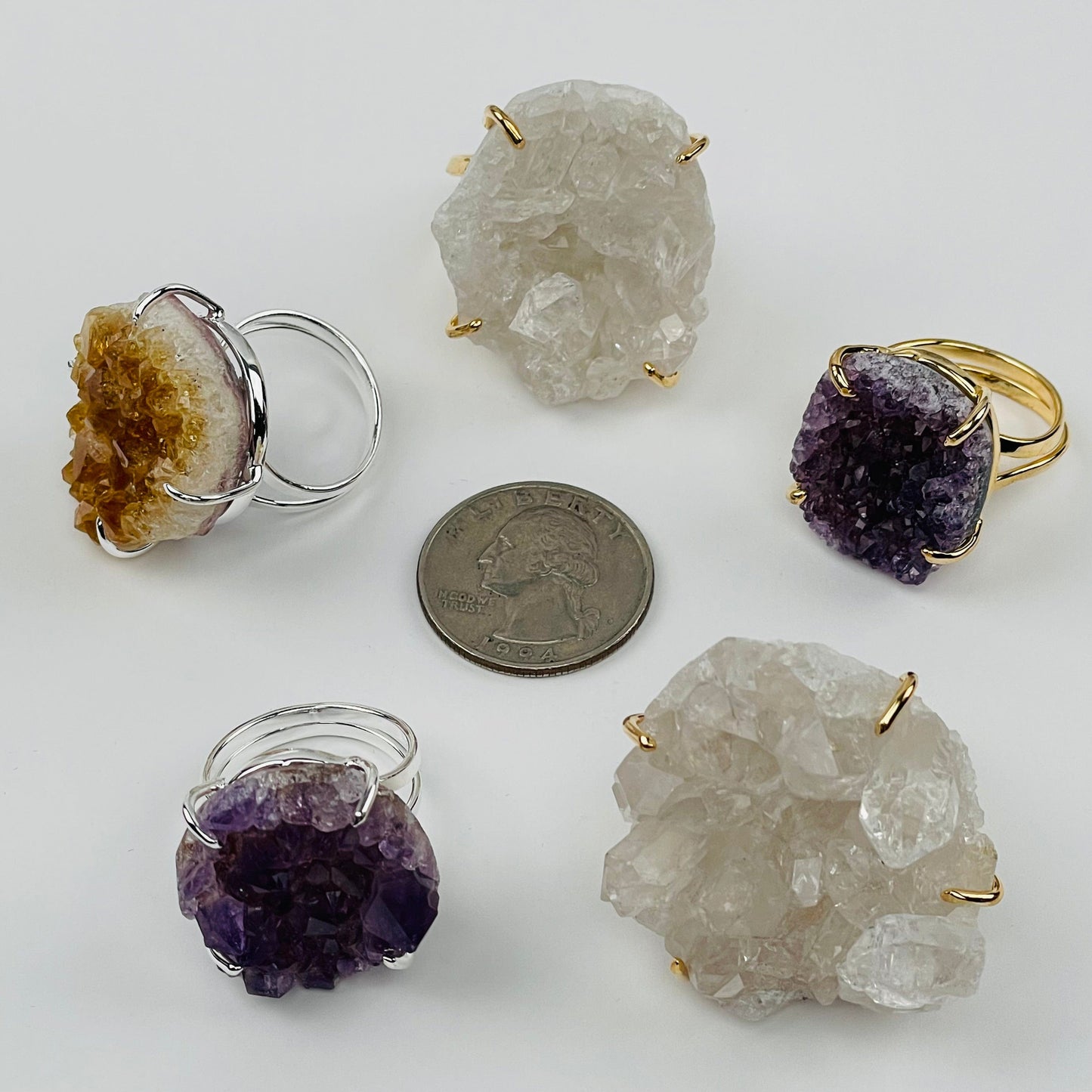 rings next to a quarter for size reference 