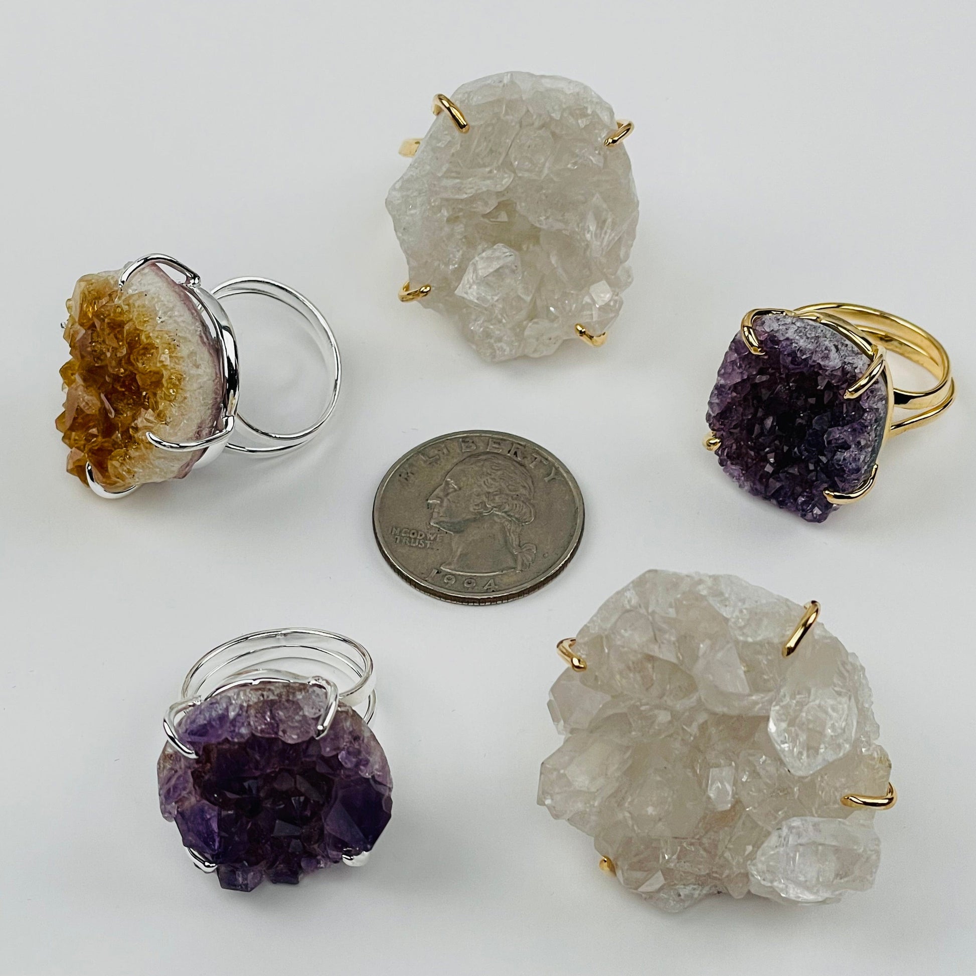 rings next to a quarter for size reference 