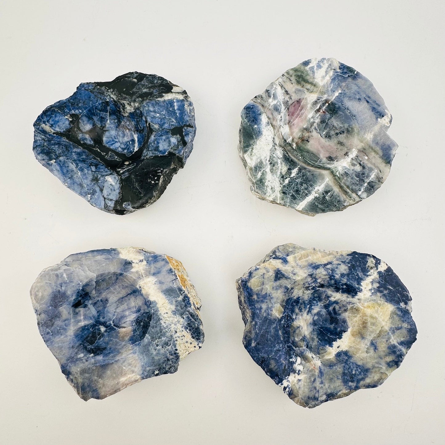 multiple sodalite dishes to show the differences in the sizes and color shades 