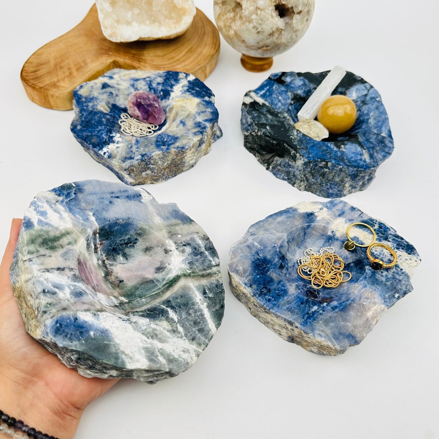 semi polished sodalite dish on hand for size reference 