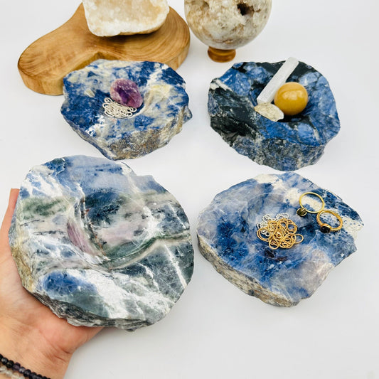 semi polished sodalite dish on hand for size reference 