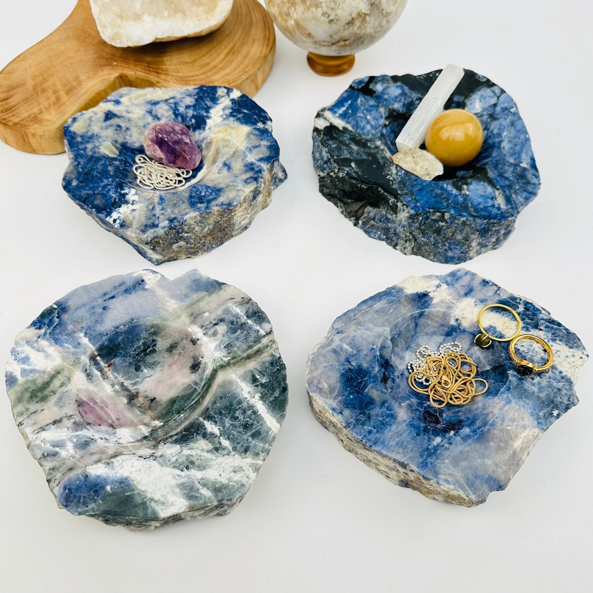 multiple sodalite dishes displayed to show the differences in the sizes and color shades 