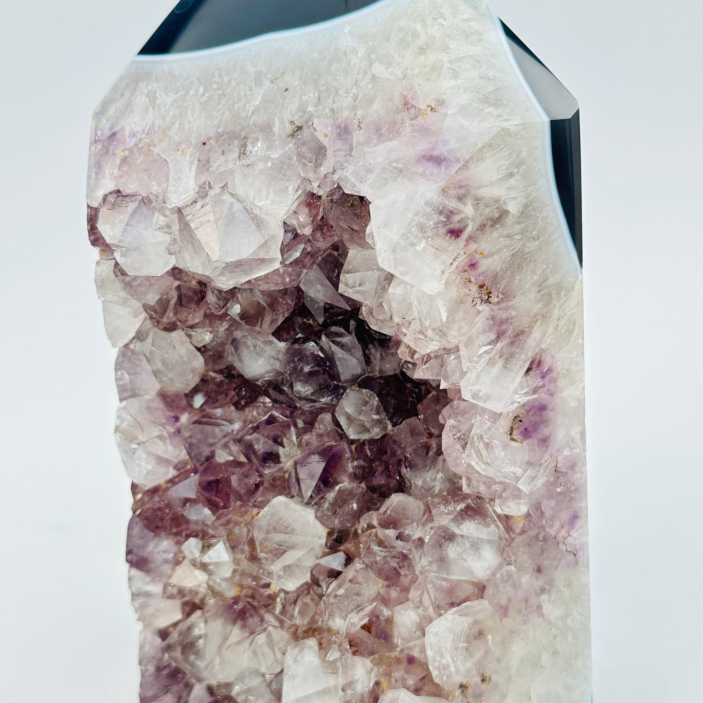 close up of the amethyst crystal clusters on this cut base 
